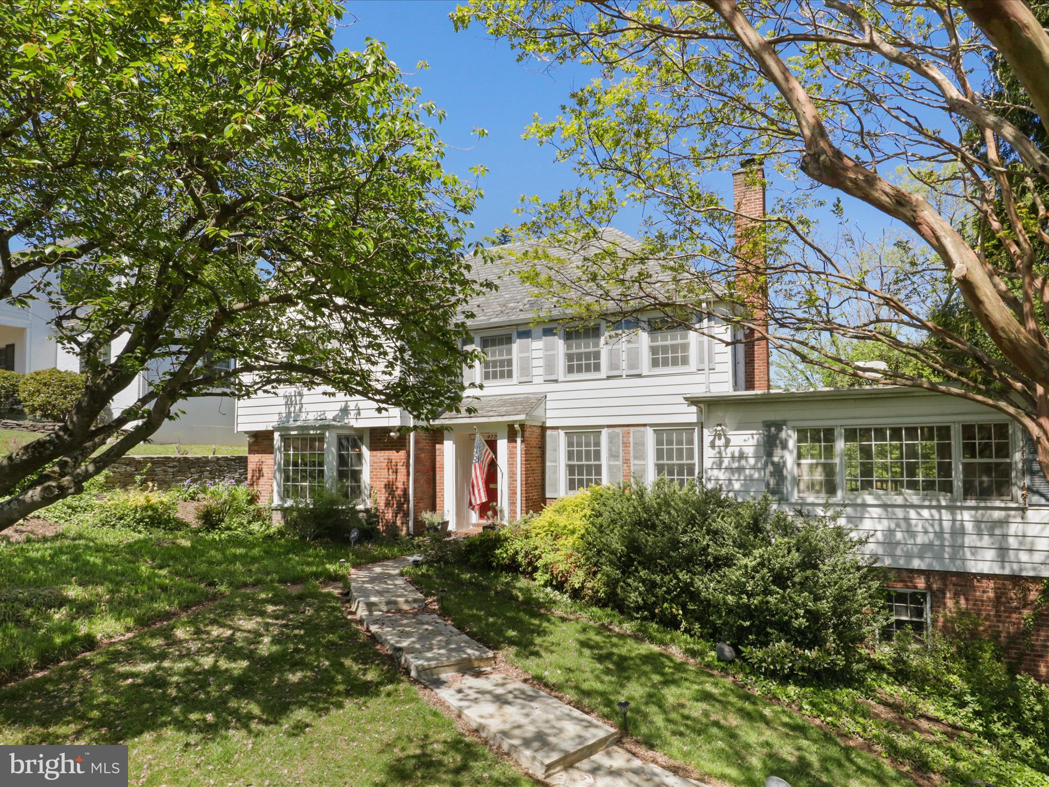 An extraordinary offering in a neighborhood where opportunities like this are few and far between. Homes on Rock Spring Rd across from Washington Golf and Country Club's golf course,  rarely come on the market ---  and now is your chance.  NEW PRICE!   NEW OPPORTUNITY FOR YOU! SELLER READY TO NEGOTIATE!
This 1940 classic three-level Colonial  is packed with potential.  Step into the main level through the  foyer that sets the tone for the rest of the house.  This level consists of a formal living room, formal dining room, an updated kitchen with a casual dining area, a spacious family room, an expansive sun porch adjacent to a multi-tiered deck complete with hot tub overlooking a private rear yard, surrounded by mature landscaping... Now for the  views! Serene, picturesque views of the lush, manicured fairways and rolling greens create a private, peaceful and naturally elegant setting that is just  steps from your front door.
The upper level offers a large primary suite with a walk- in closet and full bath along with 3 additional bedrooms and a full hall bath.  Fixed stairs to the attic...add another level if you wish.
The lower level offers flexible space plus a 5th bedroom/office with a remodeled full bath just steps away.  The laundry, a storage room with ample wine storage, complete the basement which opens to the 2 car side-load garage.
The traditional layout, solid construction and move-in condition allows you comfortable living now, with endless opportunities to renovate, expand or rebuild --- the choice is yours! This is a smart investment in one of the area's most sought-after neighborhoods.