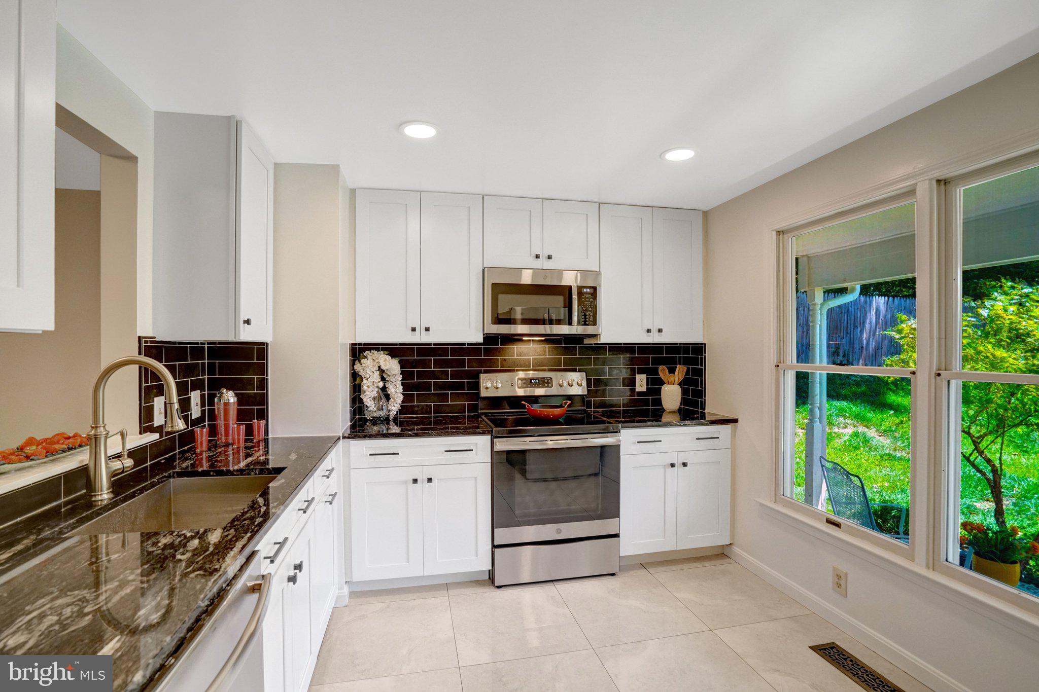 Tastefully & extensively renovated - Rare end unit on peaceful cul-de-sac features 3 beds, 1 bath, 2 level, freshly painted (2026) townhome.  
Carrier heat pump (2026) keeps the interior temperature attuned to your desires. 
Exterior show case is the architectural roof (2020) and the expanded outdoor slate patio (2021) with custom built curved seating sets the tranquil tone for cozy conversations around the firepit or to showcase your inner grill skills. The raised planters (2021) are the perfect for mingling of flowers & fresh herbs which will compliment your dishes.  
The spacious sundrenched kitchen (renovated 2019) is a meaningful show piece with white shaker cabinets, backsplash surround, flooring, stainless appliances to include a French door refrigerator, recessed lights & granite countertops. The open kitchen pass-through to dining area offers an ease of entertaining. 
Upgraded hardwoods (2019) from the entry to the dining/living areas overlook the peaceful rear setting through the sliding glass door (2019). 
Guest access to the main level half bath allows for upper-level privacy. 
Two thoughtfully placed coat closets round out storage with one at front entry and 2nd near patio entry and electrical panel (2019).
Front-loading full-size washer/dryer on main level with shelving in side closet.
Lush carpeting (2026) from stairs & hall sun tunnel (2020) lead to each bedroom offering a soft landing when waking each day. The tree canopy view through the double windows delight in a true primary retreat experience. Recessed lighting and ceiling fans compliment the primary and 2nd bedroom. 
Renovated full bath (2019) – tub, generous marble vanity, flooring, tub/shower tile surround to ceiling with 2 niches will wash the day’s activities away. 
The end-unit side gate entrance leads to additional personal shed storage. The huge encapsulated crawl adds additional space. 
Enjoy the songbirds as you sip a cup of coffee on your front porch. 
Parking is a breeze as one dedicated space is directly at your front door along with a visitor space.  Additional visitors’ spaces are around the corner of the cul-de-sac. 
Low quarterly HOA fees button up this stylish treasure! 
Ease of access to…Dunn Loring Metro, West Falls Church Metro, I-495, I-66, Rte 29, Rte 7, Rte 50, Inova Fairfax Medical Campus, Merrifield, Gallows Rd & Tysons.
Welcome the day at Compass Coffee off Rte 29.  
Enjoy Mosaic’s vibrant entertainment from the farmers market, yoga on the green, movies in the park, dog friendly Caboose Commons to various dining and shops.
Numerous nearby parks & trails…Roberts Park, Berman Park & Howard E Herman Stream Valley Park to mention a few.