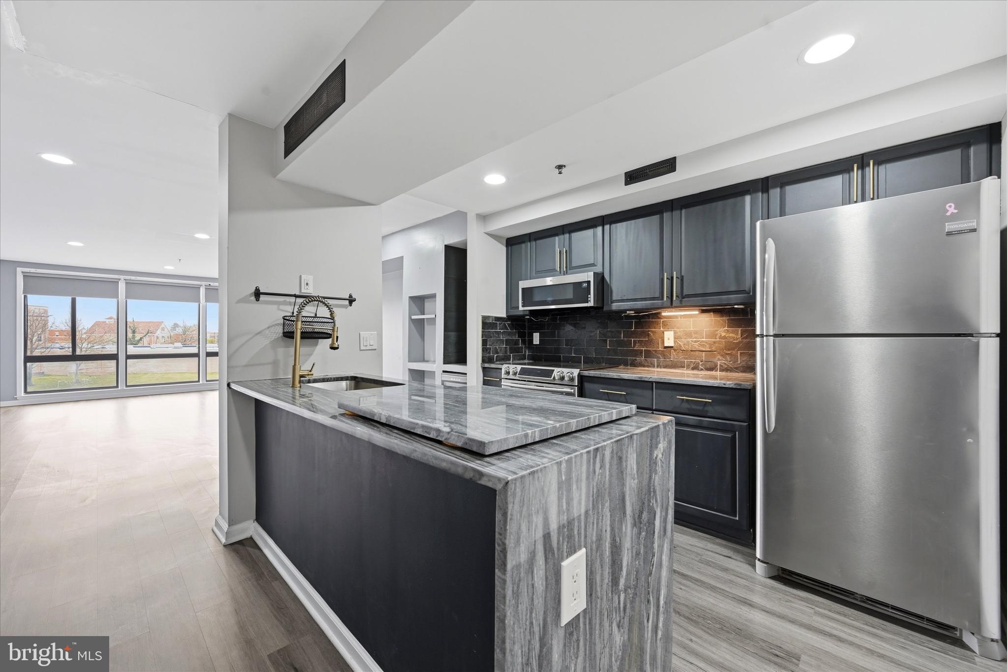 Enjoy stunning waterfront views of Brandywine Creek from this modern two-story condo in downtown Wilmington. Filled with natural light, the spacious living room features three floor-to-ceiling windows with electronic shades showcasing the beautiful river view.
The updated kitchen includes granite countertops, stainless steel appliances, new dishwasher, built-in wine refrigerator, upgraded cabinetry, and a butler’s pantry nook—perfect for entertaining. Upstairs, the primary suite offers breathtaking water views, a stone accent wall, and a built-in electric fireplace with mounted TV. The primary bathroom features a stone and tile shower, while a second bedroom and full bathroom complete the upper level. Additional features include main-floor laundry with compact washer and dryer.
Located in a secure community with optional rented parking, residents enjoy a community BBQ area and private kayak dock with storage for easy access to Brandywine Creek. Walk to downtown dining, shopping, and Brandywine Park, with quick access to I-95 and Route 202.
The condo fee covers exterior maintenance, water, sewer, trash, exterior security cameras and snow removal, offering easy, low-maintenance living. The Seller will pay off the remaining balance of the current special assessment with a full-price offer.