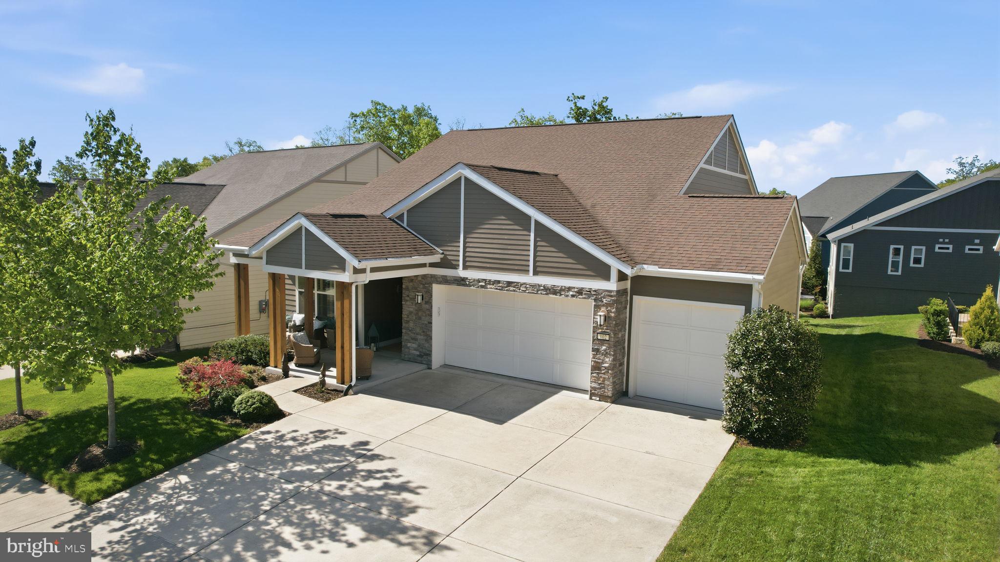 Set within the sought after Trilogy at Lake Frederick 55+ community, this beautifully upgraded 3-car garage Refresh home by Shea Homes backing to woods on the clubhouse side of the lake offers a refined blend of comfort, style, and effortless living. A thoughtfully designed open floor plan is complemented by handsome decor throughout, while two main level bedrooms and an additional lower level bedroom provide exceptional convenience and flexibility for everyday living or hosting guests.
<br><br>
At the heart of the home, the gourmet kitchen impresses with expansive counter space, high end appliances, and a seamless connection to the main living and dining areas, creating an ideal setting for both relaxed evenings and lively gatherings. Upgraded appliances include a Sub-Zero refrigerator, dual Bosch wall ovens, Cafe range, and a two-drawer dishwasher. A main level laundry room adds to the home’s practical ease.
<br><br>
Step outside to the rear deck, a perfect extension of the living space for morning coffee or evening entertaining. Enjoy the privacy of the lot backing to trees for peaceful views. The finished lower level offers remarkable versatility, complete with a third bedroom, third full bathroom, and generous space for a recreation room, media lounge, fitness area, or private guest retreat.
<br><br>
A three car garage provides abundant parking and storage, while a whole home surge protector, professionally installed by Green to Ground, adds valuable peace of mind. The home’s prime location places you on the same side of Lake Frederick as the clubhouse, pools, recreation center, and Trilogy’s renowned amenities, offering a lifestyle defined by convenience, connection, and comfort.
<br><br>
As a resident of Trilogy at Lake Frederick, you'll enjoy a wealth of incredible amenities designed to enhance your lifestyle. Dive into relaxation with both indoor and outdoor pools, stay active in the state-of-the-art fitness center, and unwind at the well-equipped community clubhouse. Savor gourmet meals at the farm-to-table restaurant and socialize in the exclusive members-only lounge. For the sports enthusiasts, tennis and pickleball courts, as well as a dog park, offer ample opportunities for recreation, while extensive lake trails beckon for serene strolls and outdoor adventures. Join a vibrant community of welcoming neighbors and future friends. Experience the pinnacle of resort living at Trilogy at Lake Frederick—where your dream home and ideal lifestyle come together seamlessly.
