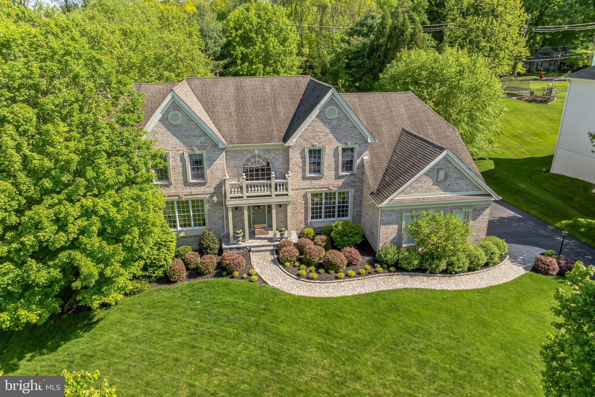 Welcome home to 319 Tarbert Dr in West Goshen Township, situated on a premier cul-de-sac lot in the highly coveted community of Westtown Chase. This spacious property offers the best in Chester County living within the exceptionally regarded West Chester Area School District. The 4 bedrooms, 4 full and one half bath home encompasses almost 5000 SF of living space with an additional 1,500 sq ft finished basement. The home embraces the best of traditional quality and details while capitalizing on a modern open plan with soaring 9’ ceilings and abundant natural light. Enter into a central foyer which opens to a formal dining room and the living room with attached study. Adjacent to the dining room is a gourmet kitchen which serves as the hub of the home. A large island with seating, abundant wood cabinetry, views to the fabulous backyard and more!  You will not be disappointed!  The spacious breakfast room with sliders to the patio and the great room with stone fireplace are both open to the kitchen. On the upper level of the home, the primary suite is truly special. With a sitting area, a walk-in closet, a lavish dressing room/closet and en-suite bathroom you will find a peaceful oasis made for true relaxation. The private en-suite bath offers a soaking tub as well as a walk-in shower, dual vanities, and separate WC. The upper level also incorporates 2 additional generously sized bedrooms with a “jack and jill” style bathroom and 4th bedroom with attached bath. The lower level of the home is finished to contribute nearly 1500 sf of living space, has a walkout exit to the backyard and the private hot tub area.  In the basement you there is a full bar complete with refrigerator, icemaker, microwave and full dishwasher, an entertainment area with projector and screen, a fully finished multi-purpose room with closet and full bath.  Outside, running along the back of the house is the incredible patio with distinct areas for a dining, lounging, and gathering.  The crown jewel of the backyard is the pool area with a stacked stone waterfall this will make you feel like you are on vacation right in your own backyard!  Just off the walk out basement you will find the hot tub in its own separate private area.   Other amenities include an attached 3 car garage and a whole house generator. The current owners meticulously maintained and improved the home during their ownership. Superbly located in Chester County, the community offers close proximity to West Chester Borough, commuter routes, and major employment and retail centers.