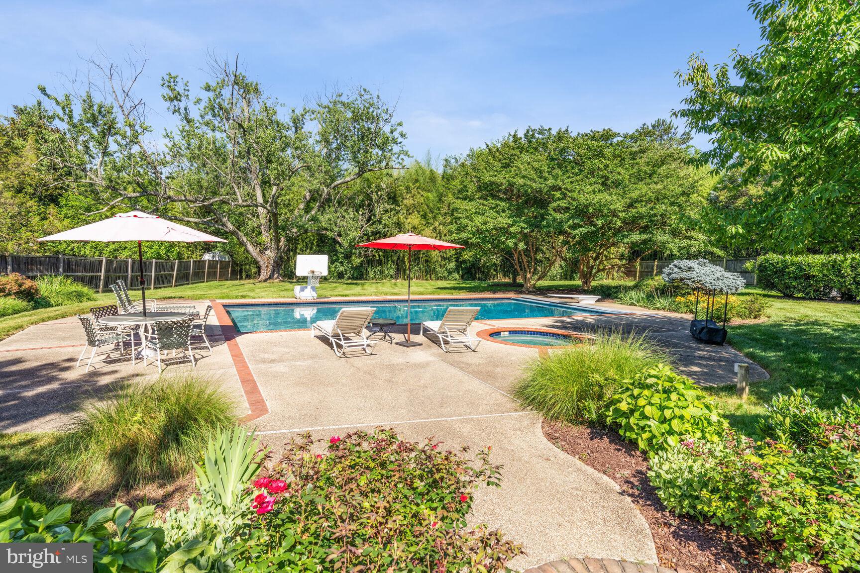 OPEN SUN 3/23, 1-3PM!
Experience timeless elegance in this magnificent Custom-Built Brad Bernstein Masterpiece!
Nestled on a beautiful 1-acre lot within the prestigious Kentsdale Estates community, this stately all-brick colonial masterpiece by renowned luxury  builder Brad Bernstein spans over 6,000 sq ft, with 5 bedrooms, 4 full bathrooms, 2 half baths, 3 fireplaces, a luxurious outdoor heated pool, and 3-car garage, blending sophisticated architectural design with modern amenities. 

From the moment you arrive, the home exudes charm with its arched windows, flagstone walkway, and grand circular driveway, welcoming you into this standout home.  Step into the grand two-story foyer, highlighted by gleaming new porcelain tile floors. The living room features an elegant marble wood-burning fireplace, while the spacious dining room is perfect for hosting. A large, private office with custom built-ins offers a stylish and functional space for those seeking a quiet retreat or home workspace.   

At the heart of the home lies the renovated gourmet kitchen, a chef's dream come true. New quartz countertops, stainless steel appliances, and resurfaced white cabinetry are complemented by an oversized quartz island offering ample storage and prep space. The kitchen flows seamlessly into the sun-drenched family room, where another brick wood-burning fireplace and a wall of windows bathe the space in natural light. A sliding glass door leads to the outdoor deck and pool area, perfect for enjoying the serene surroundings.    Additional features of the main level include beautiful hardwood floors, arched walkways that mirror the home’s arched windows, and two well-appointed powder rooms. A spacious laundry/mudroom with ample storage provides easy access to the oversized three-car sideload garage for everyday convenience. 

Upstairs, a curved staircase leads to a tranquil primary suite. Highlights include wide plank hardwood flooring (2016), two generous walk-in closets, and a spa-like ensuite bathroom complete with a soaking tub, glass-enclosed shower, dual vanities, and a private water closet. Three additional bedrooms include a guest suite and two Jack-and-Jill bedrooms, each with its own ensuite bathroom and plush carpeting.

The fully finished, walk-up lower level offers abundant space for relaxation, including a large recreation room with a third wood-burning fireplace, a dedicated entertainment area with a full bar, a legal fifth bedroom, a fourth full bath, and generous storage space. Step outside to your own private oasis, where the fully fenced backyard boasts a large deck, flagstone patio, and a refreshing pool — perfect for summer gatherings. The expansive, flat yard offers endless possibilities for outdoor activities.

Conveniently located just blocks from Potomac Village, this home offers easy access to Park Potomac, Cabin John Village, major commuter routes, including I-270 and I-495, placing you just minutes from everything Potomac and the surrounding areas have to offer.  Many recent updates enhance this home, including 3 sets of new sliding doors, a new HVAC system for the main floor, a new cooktop, wall oven, microwave (2024), as well as a  roof replacement (2009). Don’t miss this rare opportunity to own a true masterpiece in one of Potomac’s most desirable communities!   ***Offers are due by noon, Monday 3/24.***