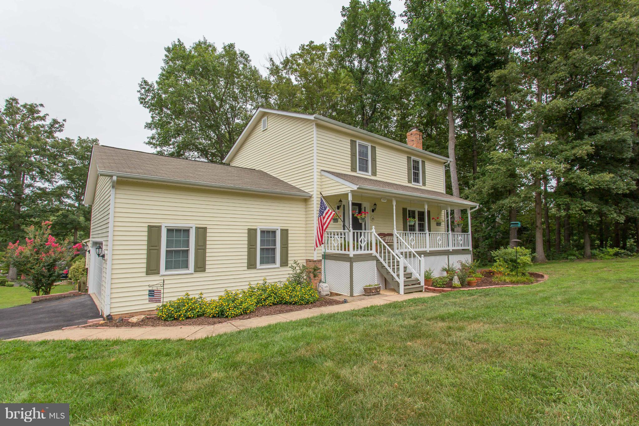 Beautiful Updated Home!!  Fresh paint throughout.  Kitchen w/granite, new SS appliances, island & wall mounted TV!.  Gleaming wood-look floors, new decorative front door, updated light fixtures & ceiling fans.  LL finished w/ full bath, family rm w/fireplace, Murphy bed & Craft/hobby rm. SGD to LL Patio. Main lvl deck overlooks fenced in back yd. Full Front Porch & side load garage w/xtra storage!