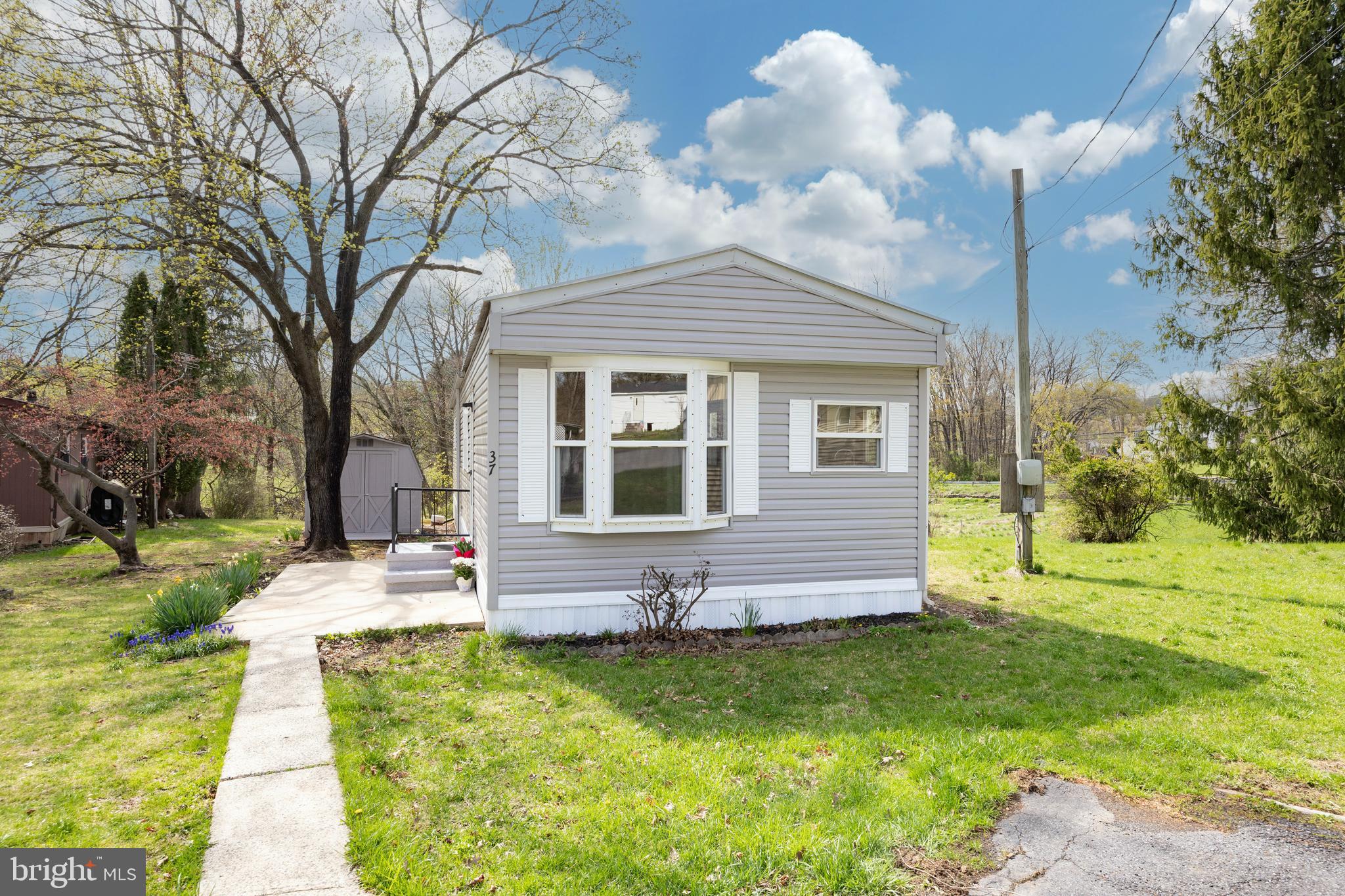 Welcome to 37 Terrace Drive.
Don't miss this spacious move in ready,  low maintenance home, conveniently tucked away on a quiet side street in the Coventry Terrace Mobile Home Park community.  Coventry Terrace is located in Spring City and the very desirable Owen J Roberts School District. With ample parking, large shed, back deck and a very spacious yard offering all sorts of outdoor enjoyment. 
Open living room & eat-in kitchen with plenty of storage and bay window, the home has been freshly painted and is move in ready.  Two spacious bedrooms and large hall bath includes newly updated shower for easy access. The Laundry room is close to the bedrooms, making wash day a breeze!  The home has been updated throughout with brand new siding, plumbing and propane heating system.  Low taxes and $685 lot rent includes water, sewer & trash. Affordable one floor living near everything!  Close to schools, shopping, and parks. And convenient to commuter routes Rt 724, Rt 100, Rt 113, Rt 422, and Rt 23. A terrific opportunity at affordable home ownership. Call and schedule your tour today!