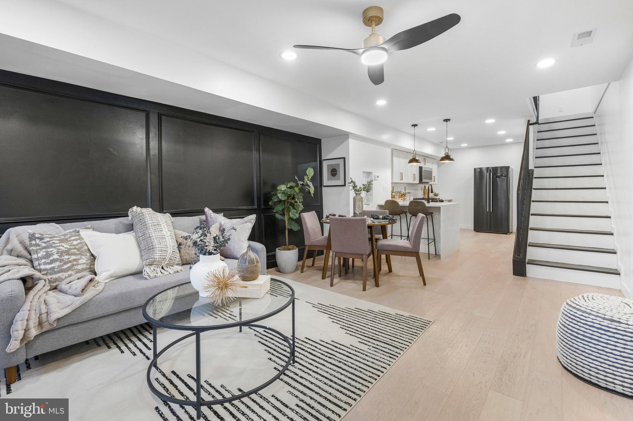Up to $68,250+ in Homebuyer Grants Available for Qualified Buyers! Including $17K Johns Hopkins LNYW Grant, $10K V2V Grant, $10K Project Reinvest Grant, $10K LNYW Grant, $7,500 FHLB Grant, $5K CDBG Grant, and $8,750 BorrowSmart Program. Step into luxury in this stunning fully renovated 5-bedroom, 3-bathroom home offering three finished levels of modern living. From the moment you walk in, you'll love the open layout, recessed lighting, custom accent wall, and upscale finishes throughout. The chef's kitchen is the centerpiece, featuring stainless steel appliances, a custom quartz backsplash, and a breathtaking waterfall quartz island perfect for entertaining. Enjoy a spacious finished basement, a large fenced backyard ideal for gatherings, and the peace of mind that comes with brand-new electrical, plumbing, and HVAC systems, all completed with approved permits and a valid Use & Occupancy Certificate. Conveniently located just minutes from Johns Hopkins University, Johns Hopkins Hospital, Clifton Park Golf Course, shopping, dining, and major commuter routes, this home combines luxury, location, and exceptional value. Don't miss your chance to own this move-in-ready home while taking advantage of these incredible grant opportunities—schedule your private tour today!
