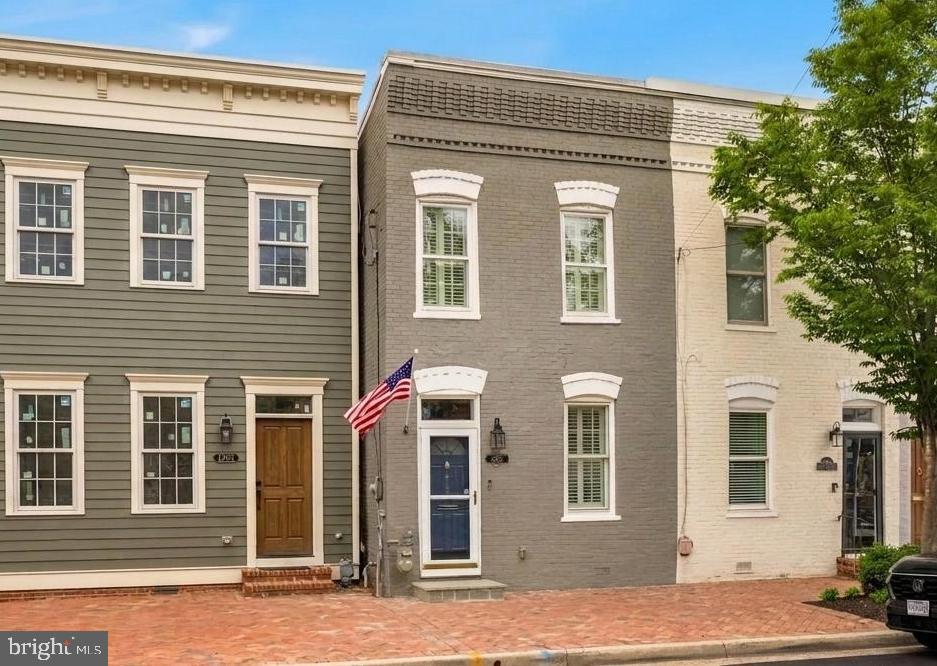 You’ll love the blend of historic character and thoughtful modern improvements this beautifully updated Parker-Gray row home offers in the heart of Old Town Alexandria. This 2-bedroom, 2.5-bath home delivers stylish, move-in ready living just moments from the Braddock Metro, neighborhood restaurants, shopping, and waterfront attractions.

Inside, approximately 1,620 square feet of living space features hardwood floors, 9+ foot ceilings, abundant natural light, and beautiful wood windows that complement the home's timeless appeal. The renovated kitchen showcases custom cabinetry, quartz countertops, stainless steel appliances, and a thoughtfully designed layout ideal for everyday living and entertaining. All three bathrooms have been extensively updated with quality finishes, including new vanities, lighting, fixtures, flooring, and beautifully renovated shower spaces. The extensive renovations were thoughtfully completed with an emphasis on quality, functionality, and long-term enjoyment.

Additional enhancements include custom closet systems in the primary bedroom, guest bedroom, and under-stair storage areas, fresh interior and exterior paint, masonry tuckpointing, updated window glass, new blinds, and a recently serviced double-sided gas fireplace that creates a warm focal point between the living and dining spaces.

Outdoor living is equally impressive with a beautifully redesigned rear yard featuring new patio pavers, brick walls, planters, fencing, and a rare oversized off-street parking area tucked behind the fenced yard.

The surrounding neighborhood continues to evolve with several newly constructed luxury residences nearby, underscoring the continued investment and desirability of this vibrant Old Town location.

Enjoy easy access to the Braddock Metro, acclaimed dining, shopping, Old Town boutiques, National Airport, the GW Parkway, and I-495. This is a rare opportunity to own a thoughtfully improved home with private parking in one of Alexandria’s most connected and evolving neighborhoods.