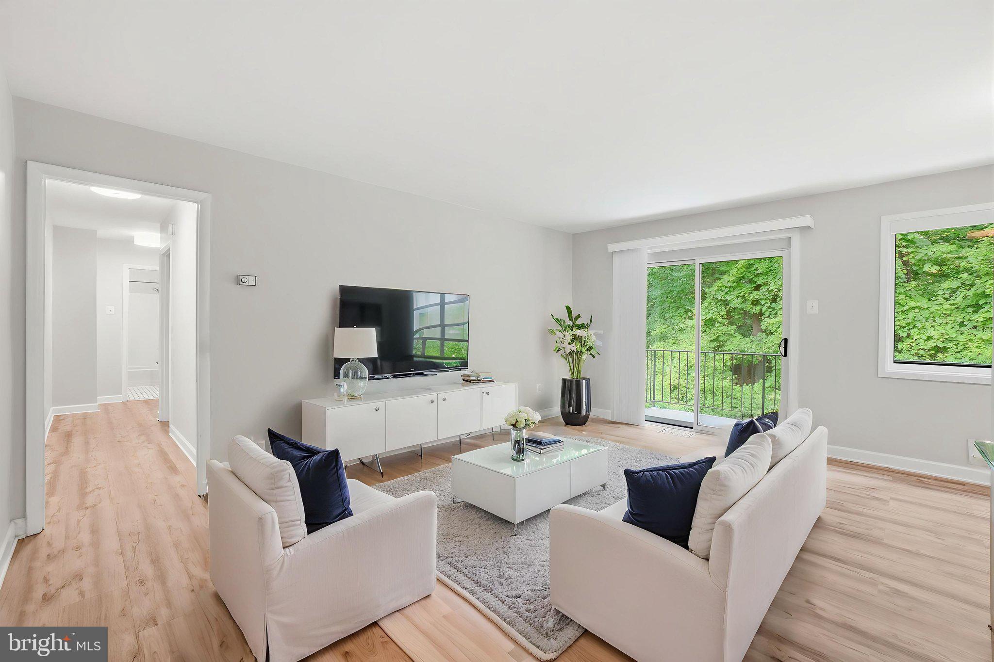 Set within the highly desirable Parkside Condominiums community, this beautifully updated 2-bedroom, 1-bath condo offers an exceptional opportunity to enjoy Bethesda living with comfort, convenience, and outstanding value. With approximately 970 square feet of thoughtfully designed living space, the home combines bright interiors, a private balcony, and a peaceful tree-lined setting just minutes from Metro, shopping, dining, and everything the area has to offer.

Inside, the spacious living room is filled with natural light from oversized windows that frame serene wooded views. Updated hardwood-style flooring adds warmth and continuity throughout the main living areas, creating an inviting space that easily accommodates both everyday living and entertaining. Just beyond, the private balcony serves as a quiet outdoor retreat, perfect for morning coffee, evening unwinding, or simply enjoying the surrounding greenery.

The kitchen blends style and functionality with white cabinetry, granite countertops, a gas range, dishwasher, and ample storage. Positioned adjacent to the dining area, it creates an easy flow between living spaces while maintaining a practical layout for daily use. Both bedrooms are generously sized and bright, offering flexibility for guests, a home office, or additional living needs. The updated full bath features timeless finishes and a tub/shower combination.

Additional conveniences include permit parking, extra storage, and in-building laundry facilities, making day-to-day living refreshingly simple.

Life at Parkside extends well beyond your front door. Residents enjoy beautifully maintained grounds, mature trees, and an impressive collection of amenities including an outdoor pool, tennis courts, picnic areas, a community center, and common green spaces. Even better, the condo fee covers many major utilities and services, helping create a truly low-maintenance lifestyle.

Location is where this home truly shines. Grosvenor-Strathmore Metro is less than a mile away, providing easy Red Line access to downtown Bethesda, Washington, DC, and beyond. Strathmore Music Center, Pike & Rose, Rockville Pike shopping and dining, grocery stores, parks, and major commuter routes are all nearby. Outdoor enthusiasts will also appreciate quick access to Rock Creek Park trails and Montgomery County's extensive park system.

Whether you're a first-time buyer, downsizer, investor, or simply looking for an affordable entry into one of the region's most sought-after communities, this home delivers a rare combination of space, amenities, location, and value. Bright, welcoming, and ideally positioned, it offers an easy lifestyle in the heart of Bethesda.
