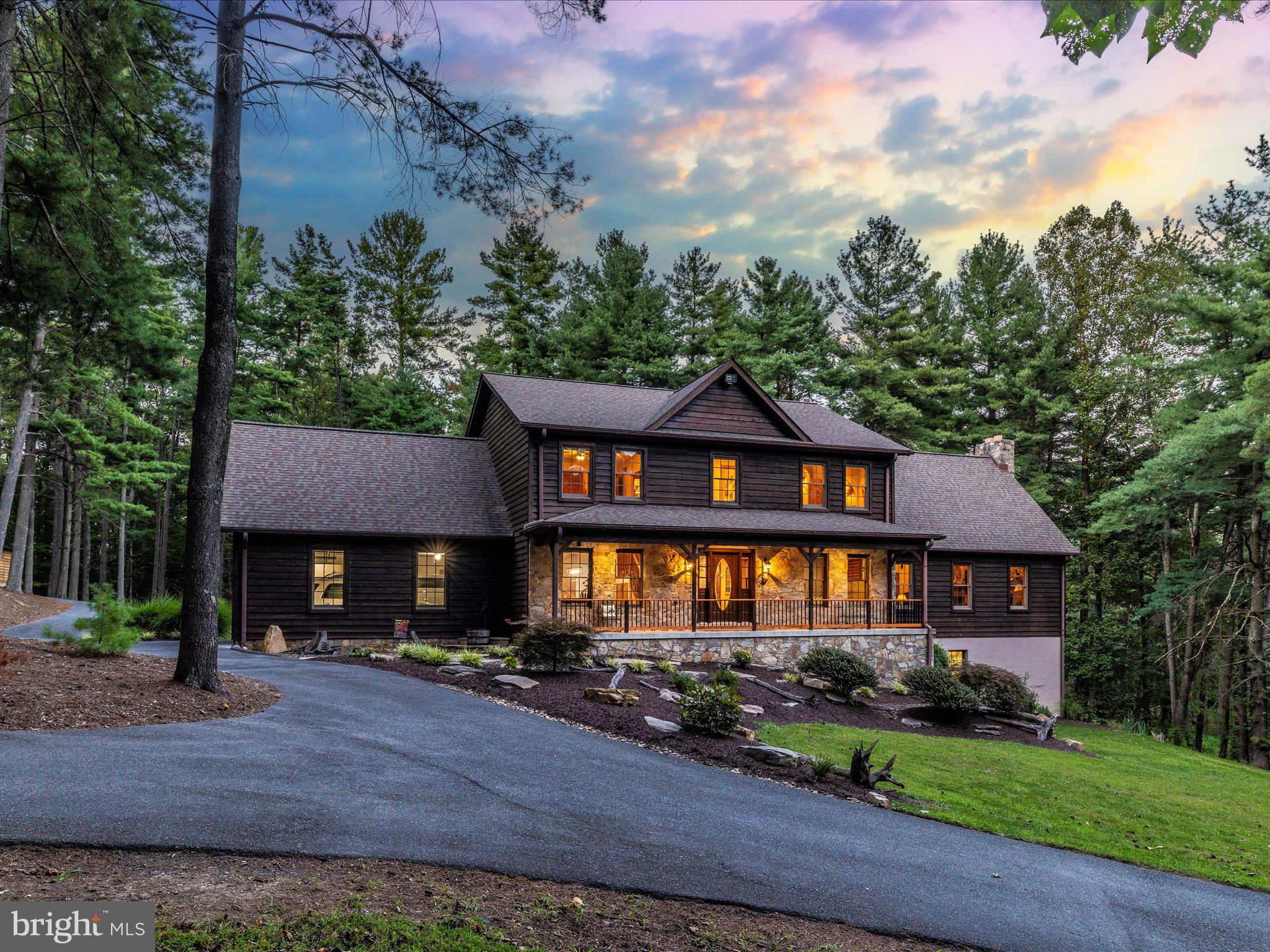 Prepare to be mesmerized.

Tucked away near Mar Lu Ridge’s 500 acre preserve, lives a stunning Hemlock sided warm cabin like home exuding privacy, luxury, comfortable “at home opulence” and serene peaceful nature.  This stunner is between  the quiet and desirable community of Jefferson and Route 15 leading into VA, WV and the rest of gorgeous Frederick county.  While living so peacefully on acreage and surrounded by breathtaking scenery, it’s an anomaly that you can reach the MARC in less than 10 minutes.  You can cross into lovely Lucketts, VA in about the same.  This is the perfect location. Welcoming you home is a quiet tree enclave  and 1000 feet of paved and sealed blacktop circular driveway.  Pull right into an oversized 2 car garage with storage and enjoy the convenience of walking right into your family organization center with deep custom built ins.  The laundry machines, storage and organization continue to perfect the “mud room” welcoming space.  The finishes are pleasing to include grey ceramic tile, white subway tile, rubbed oil bronze pot filler  and new appliances in the fabulous new kitchen.  A beverage cooler and double wall ovens situate alongside a bright quartz island.  The enormous deck with full time propane hard line for cooking on the grill are mere steps from the eat in kitchen and wine bar.  A deep sunken family room with sun-drenched windows, exterior doors and a massive stone fireplace create a natural calling to sit, stay and relax.  A study, spacious dining room and main level bedroom and full handicap accessible bath add options for wonderful carefree living and incredible entertaining.   The second floor is the perfect location for an owner’s retreat on its own hall and dedicated wing.  The sitting area boasts a light filled loft overlooking the family room and allowing the new owner to decide if it’s a craft day, a reading morning, a Sunday morning puzzle or just a fabulous coffee sipping spot.  The owner’s suite has a stunning tile shower and sunken tub with a separate water closet. A makeup table and dual vanity are anchors in the large devoted space.  Large linen closets and walk in closets are featured in the hall bedrooms alongside a gorgeous updated bathroom.  Plush carpet, bright cheery windows and million dollar views await from the 2nd floor vantage point.  The lower level has a dreamy workshop with drafting tables, ventilation, heating and cooling comfort, 10ft ceilings and an incredible operation for creating and designing.   Seeing is believing.  It’s *all* negotiable! There is an additional detached garage with a hideaway roll up door, ventilation and a hanging heater steps from the rear deck of the home.  Carport storage, deer feeders, 3 propane tanks, a whole house generator and 3 heating and cooling systems are a few of the amenities worthy of remarks.  The list goes on.  We have sitting porches to appreciate galaxies, meteor showers and the enormous solar system unencumbered by light.  Nature is at home on Mountville road where you’ll see turkeys, deer, black bears, eagles and more! Welcome Home to peaceful 4414 Mountville Road.  A full list of unbelievably detailed and meticulous amenities is available for your thoughtful review while you enjoy a very special tour.