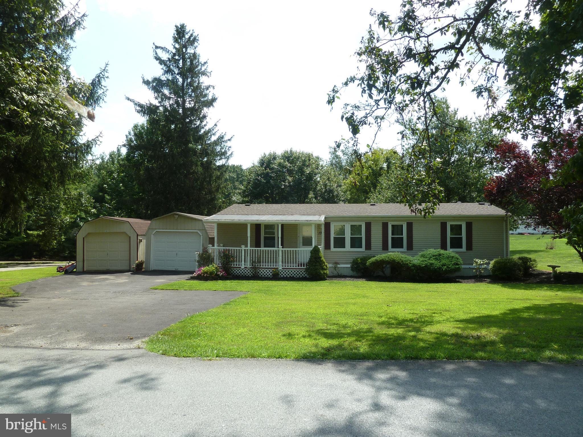 A little bit of country comes with this 3BR, 2BA double-wide located minutes to I83, Rt30, East York and Red Lion conveniences. Situated on an half acre lot with large paved driveway, detached 12x30 garage with opener, 12x22 detached garage and storage shed. A covered front porch welcomes you into the home with cathedral ceilings, living/dining room, large kitchen ample counter and cabinet space. There s also a master suite with private bath. Step out the slider to a deck, with Sunsetter Awning, overlooking a wonderful backyard where you can watch the birds. Ready for immediate occupancy! Hurricane anchor system when new. Roof approximately 5 years old. Replacement windows in 2008. AGENTS   Please read Agent Remarks!
