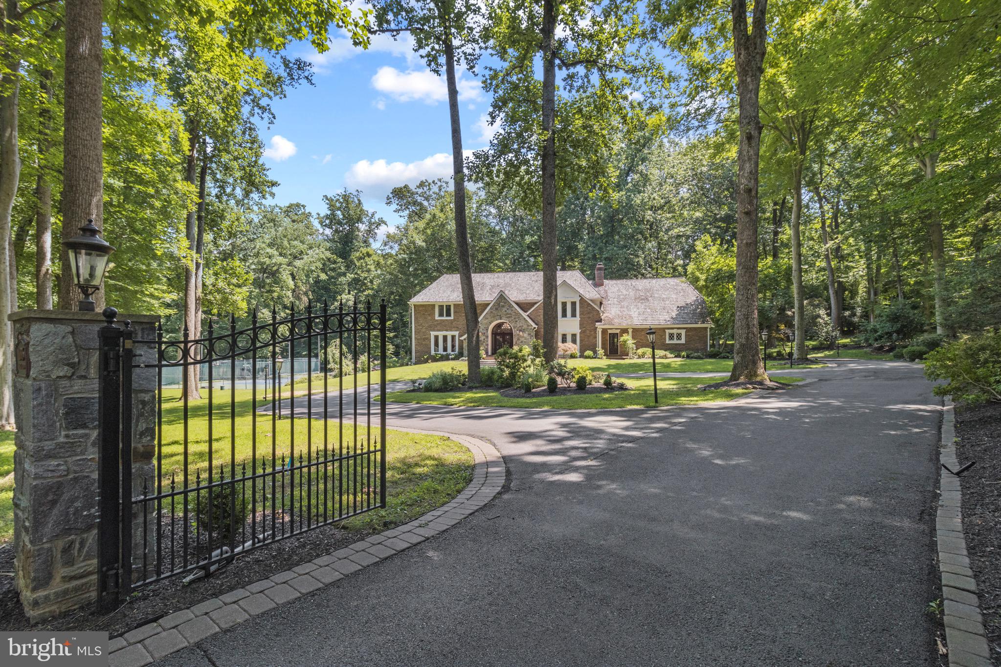 Welcome to 11005 Tara Road.  Initial feedback on this home are that the pictures don't convey how fabulous it is.  You must see this in person!   This immaculate estate home exudes balance, grace, and elegance!   It has a wonderful feeling about it that is calming and comfortable.   If you're tired of looking at grand homes that are tired and worn, you will love the opportunity to own this private, well-maintained masterpiece at a smart price.  The house flows incredibly well and the oversized entertaining spaces are large enough to host all your parties while still exuding warmth and charm.  Pristine Brazilian cherry floors  throughout the main level add so much beauty.  Details, Details!  NO small detail was overlooked here.  From the staircase lighting, to the sophisticated  smart household audio speaker system, owners spa-bathroom, the motorized chandelier for cleaning, and multiple dishwashers and beverage fridges, you won't want for anything here.  Move right in and enjoy your private retreat.  The 2+ acre estate abounds with privacy, tucked far back from the road and surrounded by trees.  Your chef's kitchen features a large center island, a large gas thermador range, separate conduction cooktop, large thermador fridge and separate beverage fridge, two dishwashers, over the stove pot filler, and more.   In the owners' suite you will find trayed ceiling, double sided gas fireplace, and private balcony.  Enjoy your morning coffee from your private secluded balcony. The expansive owners' bath and closet boast both steam shower and separate dual head shower, luxurious spa-soaking tub, private toilet closet with bidet, heated travertine floors, and cedar closet. Guys you'll love the oversized three car garage and separate man-shed with its own motorized garage door and three surround sound theater areas.  The beautiful tennis court is recently resurfaced with brand new LED lighting installed. The gorgeous salt water pool can be converted to chlorine if desired.  Pool mechanicals were recently replaced, including updated motorized retractable cover.  Outdoor lawn sprinkler system, extensive stone hardscape, and sophisticated twightling lighting allow you to enjoy fairy-tale evenings playing tennis or lounging in the heated pool or hot tub with your friends and family.   The home has an expansive walk-out basement that includes an entertainment bar with fridge and dishwasher, wine nook, gym or nanny bedroom, and full bath.   Household security system with movement sensors will help keep you and your loved ones safe.  This house is all you've dreamed of and more.  It won't last long at this price.