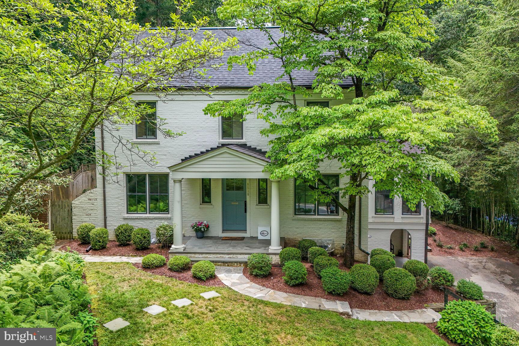 Welcome to 6516 Broxburn Drive, an exquisite four-level residence that seamlessly combines the original Colonial house and the stunning contemporary addition with a complete remodel by award-winning Moore Architects in 2018-2019. The property backs up to the woods of Cabin John Creek Park making it a nature lover's delight. The side entry from the driveway via a covered porch leads to a large mudroom open to the TV room and an expansive recreation room. The main level of this remarkable home is designed for everyday living and elegant entertaining with both formal and casual living and dining areas. The modern great room includes a gourmet kitchen with a long marble island breakfast bar, a spacious family room and a dining area; there are glass French doors to the rear terrace, patios and gardens. The beamed ceiling is nearly 14 feet tall. The great room is partially open to the 30-foot-long formal living-dining room with a wall of built-in library shelving and a wood burning fireplace. The main level also hosts a fifth bedroom/office and full bath off the foyer at the formal front door entrance as well as a bright sunroom with Moroccan inspired tile at a side entrance leading to patio gardens and stone steps to the driveway. The second level offers three well-appointed bedrooms, two full bathrooms, and two lovely balconies with serene outdoor views. The top floor is dedicated to a wonderful primary suite featuring a generous walk-in closet, spa-inspired bath (soaking tub, glass shower stall, and dual vanities), and a balcony creating a unique private retreat. Multiple outdoor gathering spaces and meticulously landscaped grounds create a welcoming environment for socializing, relaxing, and enjoying the best of indoor-outdoor living. A one-car garage and two driveway parking spaces complete this wonderful opportunity. This beautiful Bannockburn neighborhood is close to Glen Echo Park and the C&O Canal trails; it's within the highly sought-after Walt Whitman HS/Pyle MS/Bannockburn ES school cluster. The location is minutes away from downtown Bethesda's dining, shopping and more; there's easy access to main roads for commuters to DC or to I-495 and I-270 for VA and MD.