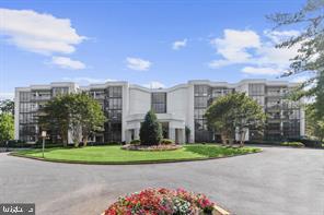 DO NOT MISS THIS STUNNING 2 BEDROOM CONDO in the Pavillion in the Park community.  This home has been completely renovated with custom lighting, designer tile, hardwood flooring, gourmet open concept kitchen and so much more. The Gourmet Kitchen features brand new stainless steel appliances,convertible Samsung fridge and freezer, quartz counter tops, custom tile back splash, and a custom island with quartz counter and seating for three. The main living area features recessed lighting, new flooring and flexible space to design your own living plan.  The spacious porch has three access points: from the living room and both bedrooms. The bedrooms feature new luxury carpet, ample storage and custom lighting. The primary en suite bath features handmade Italian tile, walk-in shower, over-sized vanity and additional lighting. The laundry room features brand new ADA compliant washer and dryer. 

This Unit comes with a Storage Room and a Parking Space in the Garage that is close to the Elevator. Pavilion in the Park Amenities include secure access, 24/7 Front Desk, Valet Service, Doorman, Fitness Center, Meeting Room, Library, Large Pavilion Party Room and Courtyard. This Home is Located close to Shopping, Restaurants, and Recreation Facilities and Commuter Routes.