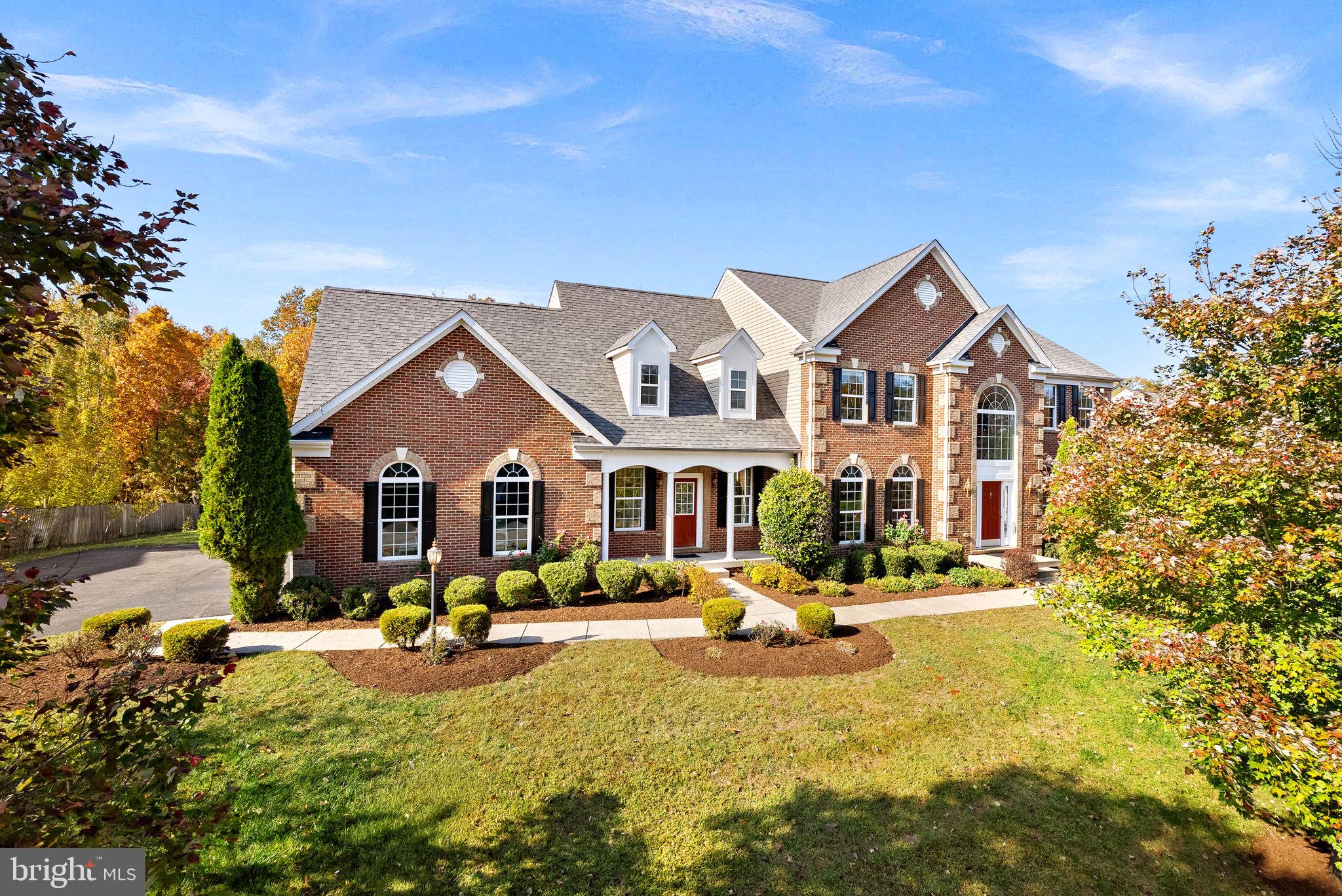 🏡 Back on the Market—No Fault of the Sellers!

This stately brick K. Hovnanian Kentucky model in the sought-after Evergreen Hamlets community offers timeless architecture and over 6,700 finished square feet of elegant living space. Nestled on a picturesque 1.04-acre wooded lot, this home features a three-car side-load garage with EV charger and a serene private setting—ideal for a future pool.

Enter through a grand two-story foyer with a curved staircase and abundant natural light. Hardwood floors and detailed crown molding flow through the formal Living and Dining Rooms, each enhanced by brand-new lighting—perfect for entertaining. The spacious Family Room centers around a stone gas fireplace and opens to a gourmet eat-in Kitchen with granite countertops, a large island, brand-new stainless steel appliances, and a bright sunroom overlooking the lush backyard. A private Office with built-ins and a large Mudroom add convenience, while the expansive Trex deck provides a relaxing outdoor retreat.

The Primary Suite impresses with a tray ceiling, sitting room, two walk-in closets, and a luxurious spa bath featuring dual vanities, a jacuzzi tub, and a separate shower. Three additional Bedrooms—each with brand-new ceiling fans—include one en-suite and a Jack-and-Jill layout with dual vanities. A Laundry Room on the bedroom level adds everyday ease. (Brand-new lighting throughout!)

The fully finished lower level is an entertainer’s dream, offering a custom Wet Bar, Media Room with projector, Recreation Room, Bedroom, and full Bathroom.

Located minutes from Brambleton Town Center with shopping, dining, and healthcare, and offering easy access to Routes 7, 28, and the Dulles Greenway. Situated within the Independence High School / Brambleton Middle School pyramid and just 5 miles to the Ashburn Metro and 15 minutes to Dulles Airport.