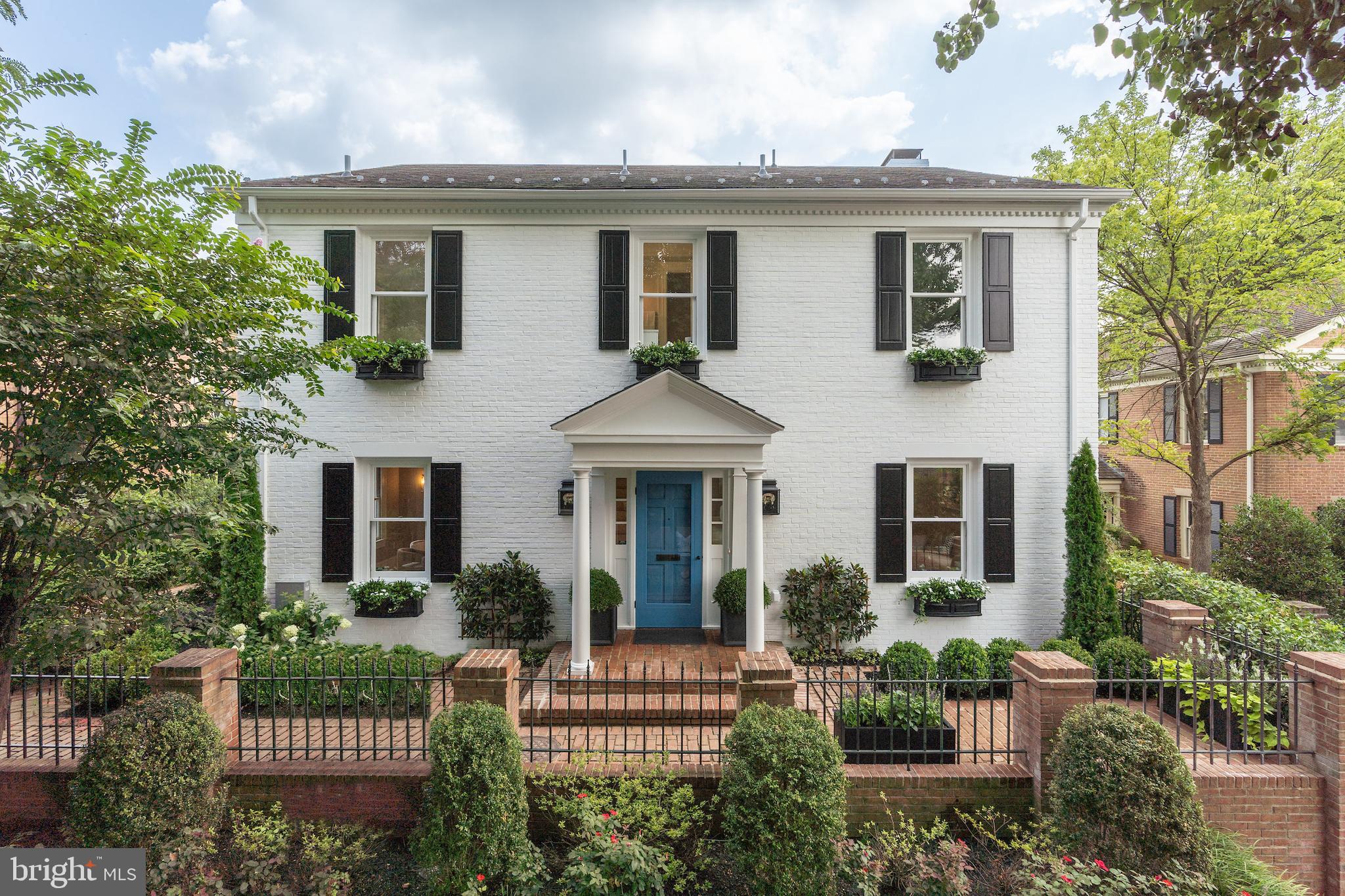Completely renovated from top-to-bottom by renowned Georgetown builder Cecchi Homes, this classic Colonial perfectly melds modern design with traditional elegance in a historic neighborhood setting. This private, light-filled home is a green oasis with its gardens and courtyard entrance framed by sweeping, mature trees. 1 car Garage through Gate on Avon Pl. 

Securely nestled in the private community of Tudor Walk located on coveted 31st Street across from historic Tudor Place, this detached 6BR/6.5BA Colonial features an oversized primary suite with dual walk-in closets, large bedrooms, all-marble bathrooms with Waterworks fixtures, and solid wood floors. Designer finishes through-out include custom paneling and woodwork, superior finish painting, wall coverings, and exquisite lighting by Visual Comfort.This home delivers an elegant and neutral canvas to make your own.

Main Level Features a Gracious Foyer with herringbones hardwood floors and walk-in Mud Room Closet, Paneled Library with custom built-ins and Powder Room, Formal Dining Room with an adjacent Wet Bar / Butler’s Pantry. The Stunning Chef's Kitchen features an 8’ waterfall, marble island, JennAir refrigerator, Wolf speed oven, and cooktop with griddle, Cove dishwasher, ice maker and wine/beverage center.

Kitchen opens to a large Living Room with marble fireplace, 3 sets of French doors that  brings the garden into the family space. Backyard / Patio features a pergola with seating and outdoor brick fireplace, built-in grill with storage and refrigerator, premium, hypo-allergenic, maintenance-free turf lawn, and ample space for entertaining and a pool.

The luxurious primary suite boasts elegant finishes throughout including sea grass wall coverings, and marble fireplace with vintage mirror panels on either side. Soaked in natural light from surrounding windows, the spacious suite enjoys 2 walk-in closets, each with custom built-ins.The Primary Bath glows in white fluted paneling and marble with a separate toilet closet and storage, heated floors, heated towel rack, custom marble shower bench, steam shower, body sprays, and rain shower.