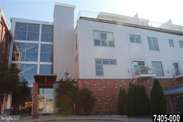 Downtown Living at Its Finest, centrally located, this Luxury Condo is an architectuctural beauty that has been professionally decorated. Offering 15+ ft. ceilings, exposed brick walls, hardwood floors, granite countertops, SS Appliances, abundance of natural light, loads of storage, plus an additional storage unit, secure parking garage w/2 spaces.