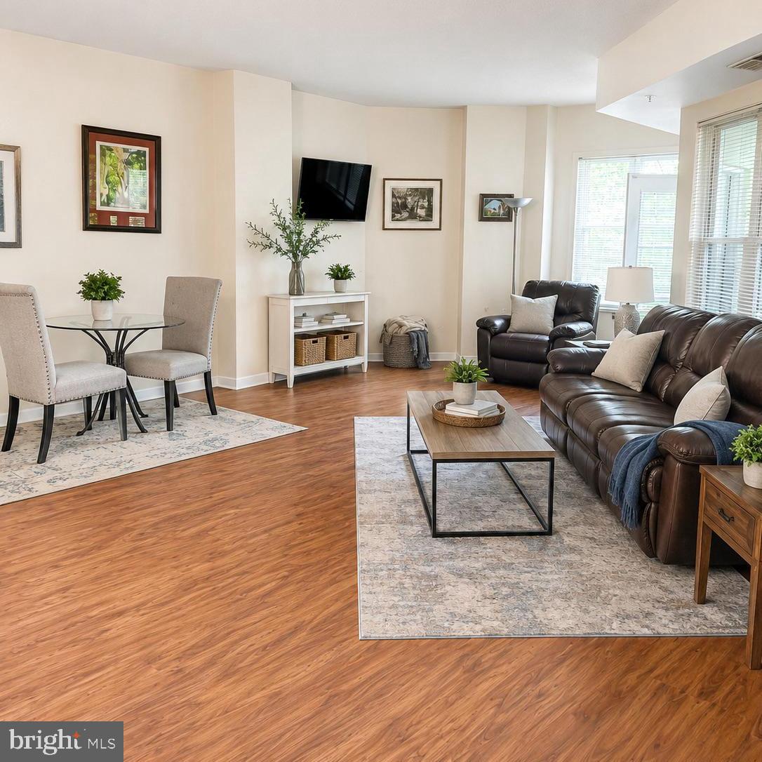 Experience the Baywoods lifestyle from Unit #202, a beautifully located 1BR/1.5BA cooperative residence in the sought-after Baywoods community of Annapolis. Nestled along the beautiful Chesapeake Bay, Baywoods offers residents the perfect blend of waterfront beauty, maintenance-free living, and a vibrant retirement lifestyle.

Unit #202 is ideally located in the North Tower, just steps from the elevator and conveniently situated on the same floor as the Bistro, making dining and socializing easily accessible. Relax and enjoy peaceful wooded views from the spacious all-season enclosed patio, offering a private and serene setting year-round.

Residents enjoy access to a wide range of amenities, dining venues, wellness programs, social activities, walking paths, and future care services—all within a scenic Annapolis setting. Call the listing agent for details on the cooperative ownership structure, buyer qualifications, monthly fees, and to schedule a private tour. Discover why so many residents choose Baywoods to enjoy the Chesapeake Bay lifestyle while maintaining independence and peace of mind.