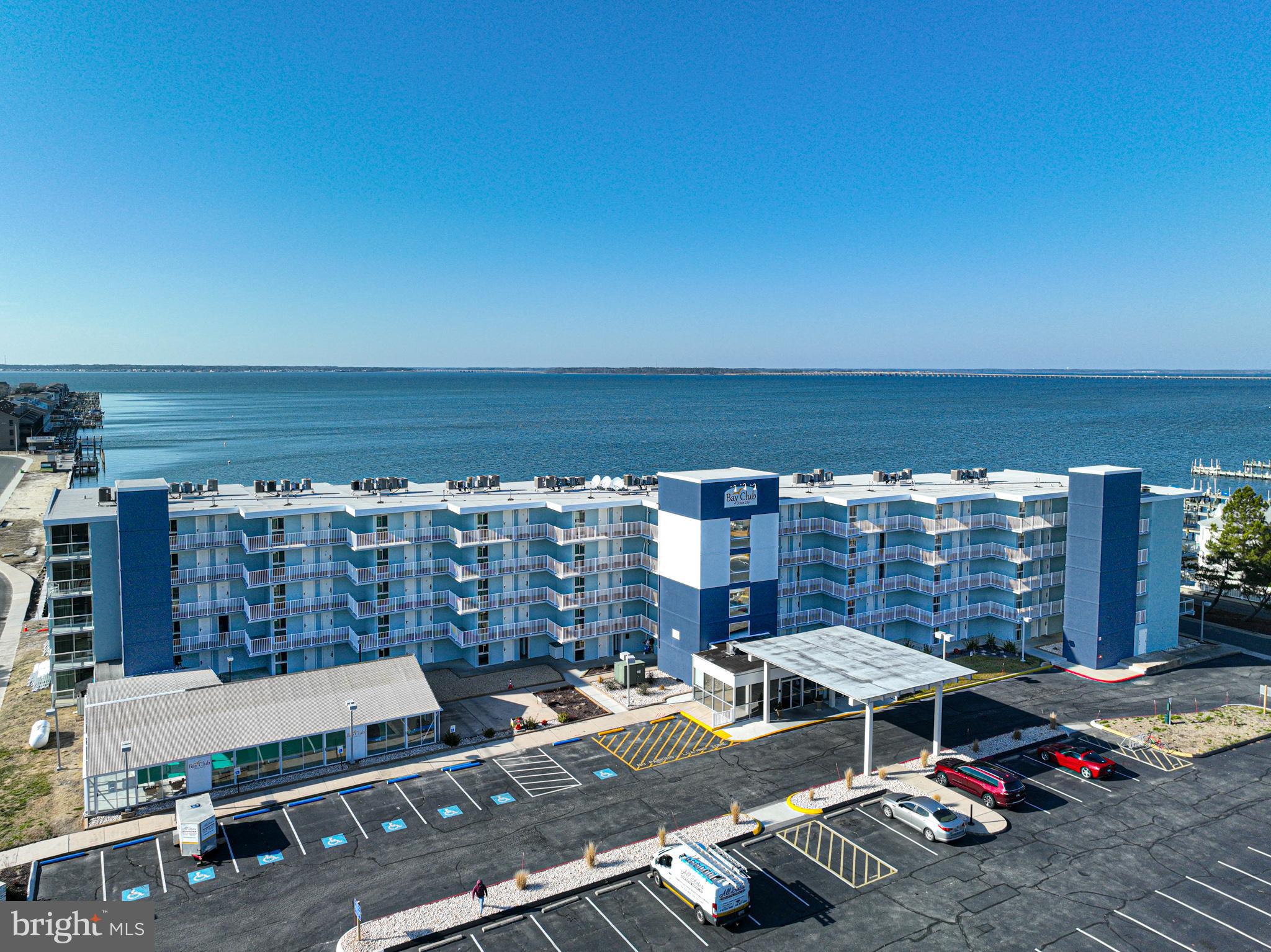 Newly Listed Bayfront Penthouse Condo in Bay Club! Welcome to your dream coastal retreat! This stunning 2 bedroom, 2  bath condo offers the ultimate in Bayfront living. 🌅 Step inside to discover a kitchen boasting solid wood cabinets and sleek granite countertops. 🍽️ The perfect space to cook up your favorite meals with ease.  Featuring a delightful mix of tile and carpet flooring, this condo exudes comfort.  Plus, with a full-size washer and dryer conveniently located in-unit, laundry day is a breeze! 🧺 The primary bedroom is a true sanctuary, complete with corner windows that flood the room with natural light. Open the sliding door and step out onto the balcony to indulge in breathtaking bay views. 🛌💖 Imagine waking up to cruise-like vistas and enjoying breakfast in bed. Pure bliss! 🚢☕ But that's not all! The building offers an array of amenities including a year-round indoor heated pool for relaxation anytime, and two parking spaces for peace of mind. 🏊‍♂️🧺🚗 With on-site professional management and maintenance, you can rest easy knowing that everything is taken care of. ✨ Included in the condo fees are water, cable, and internet.  And let's not forget the recent renovations! New windows and sliding balcony doors, the lobby, exterior of the building, and the balconies have all been beautifully redone. 🏢✨Don't miss out on the opportunity to experience Bayfront living.  Schedule your viewing today! 🌟🔑 Professional pictures to follow.