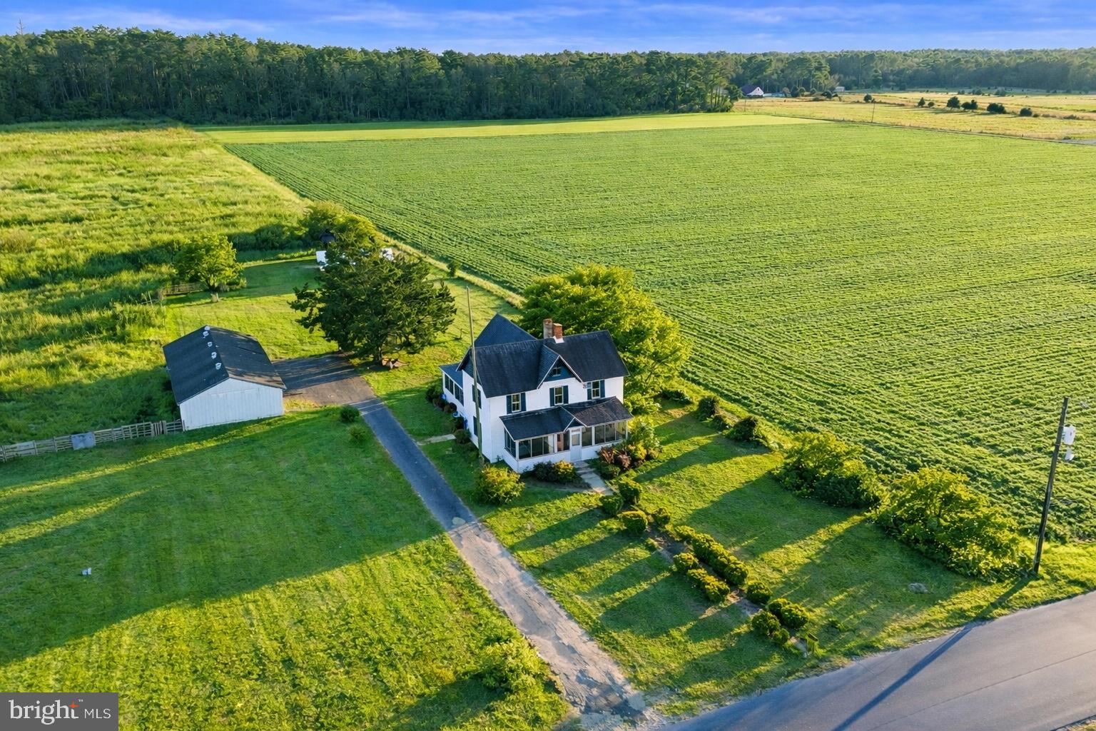 Opportunity meets open space on 12.24 cleared acres just minutes from downtown. This property offers a rare chance to create something truly special — whether that means restoring the existing home into a showpiece, building new from the ground up, or exploring future development potential.
The home itself is in need of rehabilitation, but concept photos showcase the incredible transformation that could be achieved.  For buyers with a bigger vision, the acreage provides the perfect canvas to design a private estate, hobby farm, or investment project tailored to your goals.
Outside, you’ll find a partially fenced area, an outbuilding, and expansive open land ready to be shaped into whatever your next chapter looks like. With public water and sewer already in place and potential for future subdivision, flexibility and long-term opportunity set this property apart.
Enjoy peaceful, rural surroundings while staying incredibly connected — less than 10 minutes to downtown Salisbury, a short drive to Ocean City’s beaches, and convenient access to major cities, shopping, and dining. If you’ve been searching for acreage, possibility, and a property that invites you to dream bigger — this is where it begins.  ***Concept photos are for illustrative purposes only and do not represent the current condition or actual features of the property. Images are intended solely to provide ideas of potential use, renovation, or future possibilities***