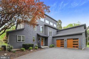 Want to feel away from it all yet only minutes to the VRE?? Lofty and bright architectural gem with treetop views and a seasonal glimpse of the Potomac River. Located near the VRE commuter rail, yet away from it all on more than two and a half acres of very private natural beauty. Four bedrooms total, 3.5 baths, including two bedrooms and a full bath on the main level, one of those bedrooms has private entry to the bath. There is an additional powder room on the main level for guests. The upper level features the primary bedroom with sky-lit en-suite bath, walk-in closet and unique loft space. This level features an additional bedroom with private, en-suite bath. On the main level, check out the dazzling, kitchen overlooking the two-story living room with windows everywhere. Two car garage and plenty of surface parking. Less than five miles from the Brooke VRE Commuter Rail Station. Enjoy the beach and river access at Aquia Landing Park.