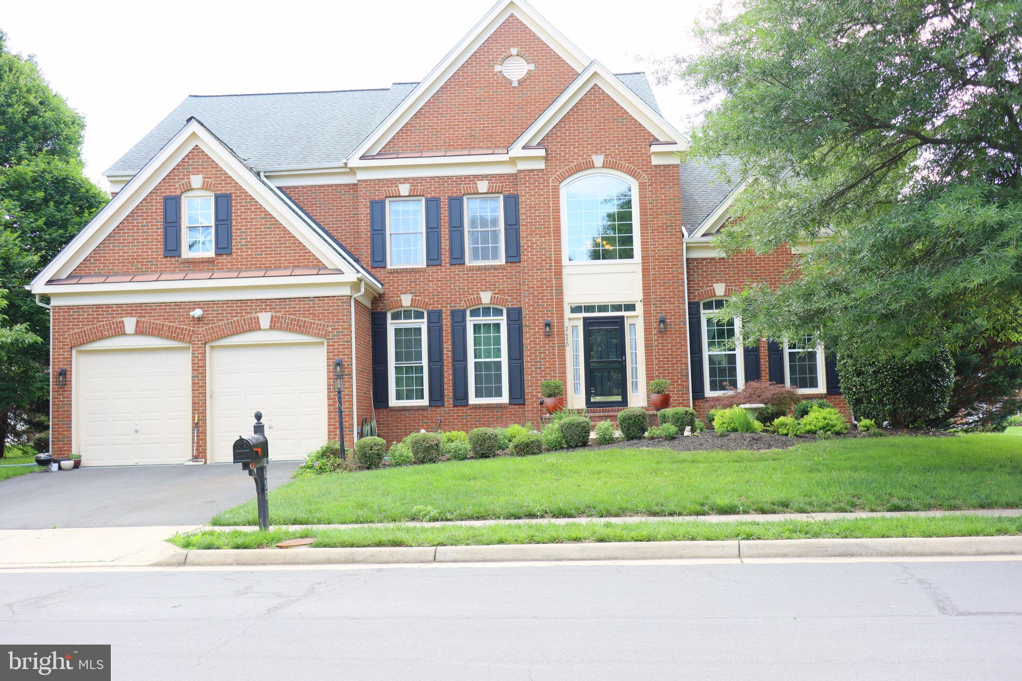 Gorgeous brick front colonial home in the highly desirable location. One of the largest models in the community! From the Welcoming spacious Front two story foyer to the shining Wood Floors, this Charming home features 4 bedroom with 4.5 bathrooms, 5,250 square feet with an abundance of natural light and an open floor plan. 
Main level features Large Light-filled Living Room opens to the lovely dining room. Foyer leads to first floor office which has French doors. This room makes working at home. Gourmet kitchen with center island with bar seating, abundant cabinetry, Bumped-out four season sunroom. Across from kitchen is a Large Family Room with beautiful architectural detailing throughout. 
The Upper Level features a Owners' Suite with a Large Walk-in Closet and Fabulous Bathroom with Glass Shower & Separate Tub. 3 additional bedrooms and 2 bathrooms, all with ample closet space.
Fully finished lower level boasts 5th bedroom, full bath, Media room, separate Bar area, plenty of storage space, and recessed lighting.
2 car garage and driveway as well as plenty of street parking. Outdoors features deck for grilling and great for entertaining your friends and family.
This home is Ideally located in the friendly neighborhood, right around the corner and excellent curb appeal. Just 5 minutes from Dulles airport and a mile from the Silver Line Metro. Easy access to DC. Enjoy a myriad of shopping, dining, and entertainment options including Reston Town Center, East Market at Fair Lakes, Fair Lakes Center, Fair Oaks Mall, and Woodland Park Crossing.  Walking distance to Frying Pan Park. The surrounding area make this community a sought-after location for commuters & a dream for those seeking the great FCPS schools.
