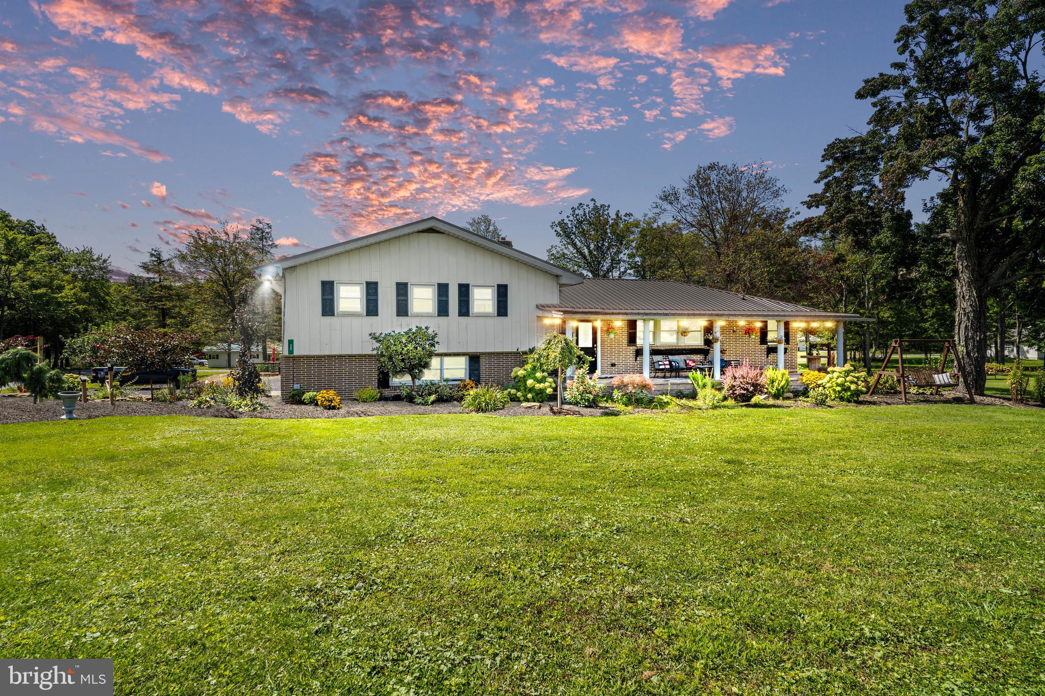 Situated across from the West Branch school, this distinguished multi-level home on over an acre offers an array of exceptional features! This property includes an expansive 50x60x16 garage ideal for various hobbies and projects. The serene outdoor environment is highlighted by a picturesque pond with a fountain, stocked with large mouth bass, perch, blue catfish, and jumbo koi. Enjoy the relaxing ambiance on the covered back deck or the open patio, complete with a fire pit and adjacent decking near the above-ground pool. The meticulously landscaped grounds feature three apple trees and six blueberry bushes. Inside, the main floor presents a timeless, original entryway. A generously sized family room with a wood-burning fireplace, a formal dining area, and an eat-in kitchen equipped with new stainless steel appliances. The kitchen is enhanced by iron window shelving for cultivating your favorite herbs or houseplants. Completing this level are a functional laundry room and a conveniently located half bath that could easily be turned into a full bath/laundry room combo! The upper level encompasses a well-appointed bedroom and a luxurious owner's suite, which boasts a walk-in closet and a full bath. The en-suite bath features a soaking tub, a tiled shower, and double sinks. The lower level features an entertainment room and 2 more bedrooms. Out the double doors to the attached garage. An underground electric fence is in place and equipment included. Explore the potential of this home and build upon the exceptional foundation established by the current owners. *metal to finish the garage is included* New furnace installed Nov. 2024