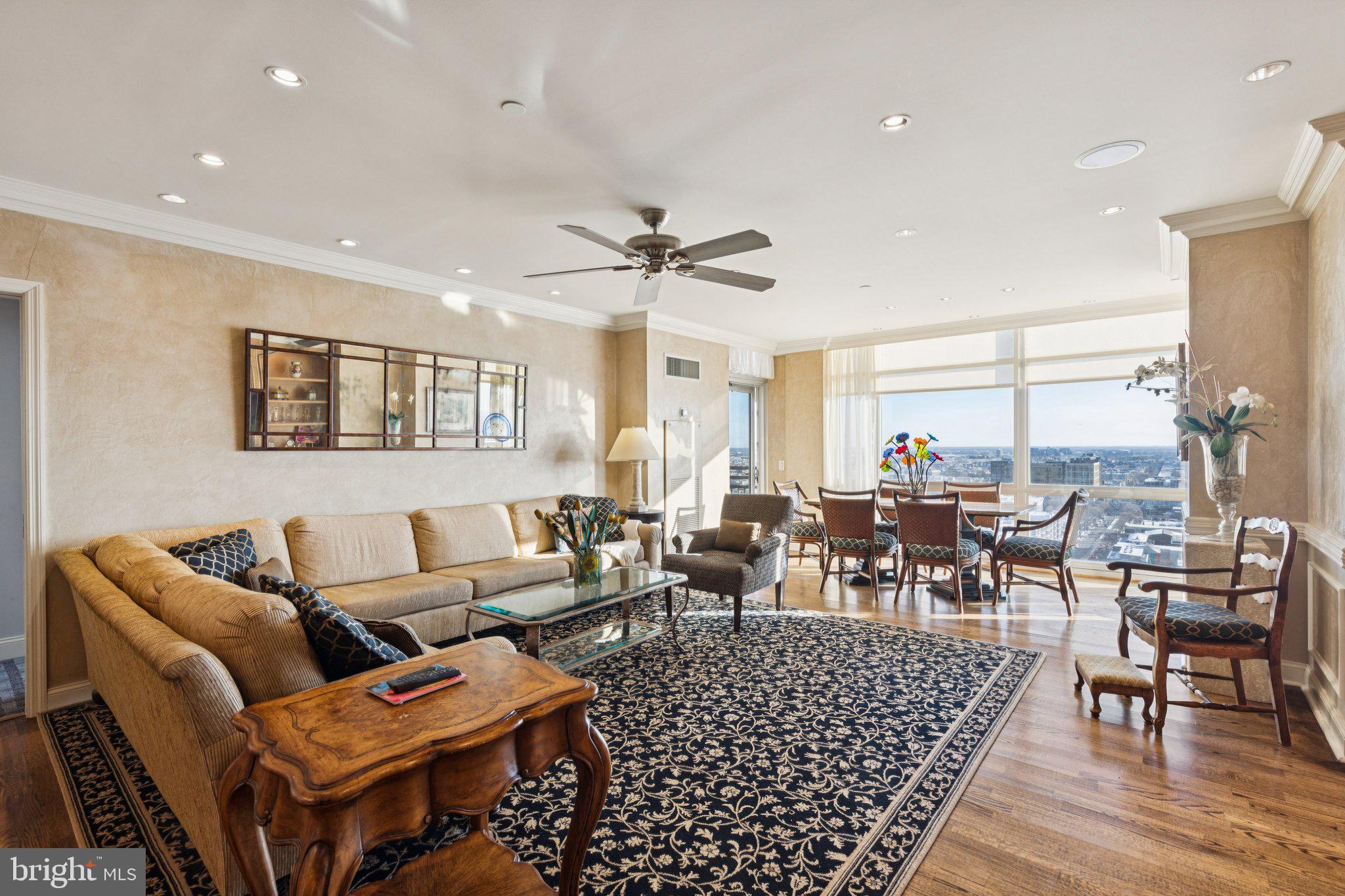 Looking for an lifestyle alternative to a townhouse without stairs? Welcome to one of the most desirable floor plans at Symphony House, an expansive 2215 square foot, three bedroom plus den residence, offering an intelligent separation of space, comfort, one of a kind custom details, one car garage parking, two storage spaces and ten closets. 

Enter this home into a gracious foyer with a tray ceiling, large closet and plenty of space to display art. Beyond the foyer is a sunlit, open concept , living room, dining area and kitchen. A private balcony is located directly off of the dining area, allowing for a seamless indoor/outdoor experience. 

The chef's kitchen has a Sub-Zero refrigerator, Viking stove & dishwasher, and a generous island that opens to the living space, ideal for gatherings while maintaining sophistication, function and flow. 

This is a true split bedroom layout.  The west wing consists of the primary bedroom with ensuite bathroom, a walk-in closet, dressing/makeup area,  sitting room,  with an additional balcony,  and two more closets on either side of the hallway to the primary suite, a second bedroom currently being used as a home office, complete with built-in desk, a full hallway bathroom, washer & dryer area. 

The east wing houses the guest bedroom suite, a large walk-in closet and a full bathroom, closed off by a discrete pocket door. 

The home has many traditional details, tray ceiling, crown moldings, wainscoting picture frame moldings, a builtin entertainment center. The quality of the custom deails are stylish,  sophiticated and well maintained. 
 
The Symphony House is a well established community with excellent amenities, including a heated indoor lap pool, steam and sauna rooms, fitness center, outdoor patios, library, clubroom, wine cellar storage and a chef's catering kitchen. 24/7 doorman service, along with concierge services. Situated on the Avenue of the Arts, easily walkable to the theatre district and fine restaurants and shopping.  It is an ideal location to view  the many city celebrations including the Mummers Day Parade and any major sporting parades.