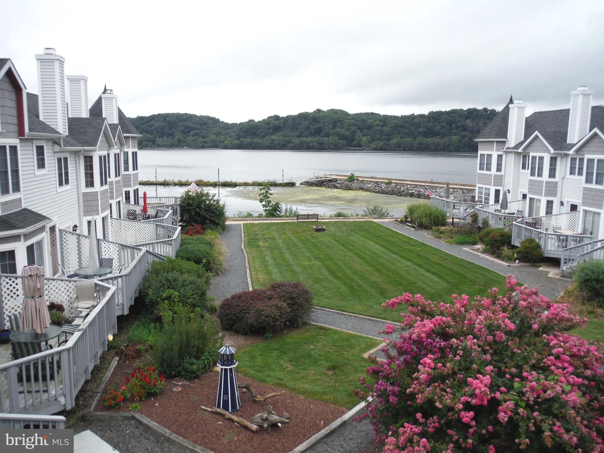 One of the best views in Tomes Landing! Largest balcony in the complex with a straight on view of the Susquehanna River. Unit also features a covered balcony off the master bedroom. Updates include new flooring on main level, updated half bath, new carpet on upper level, fresh paint, newer HVAC and water heater. Enjoy waterfront living at an affordable price! Pool membership and attached garage also included. Walking distance to shops, restaurants ,and marinas in historic Port Deposit.