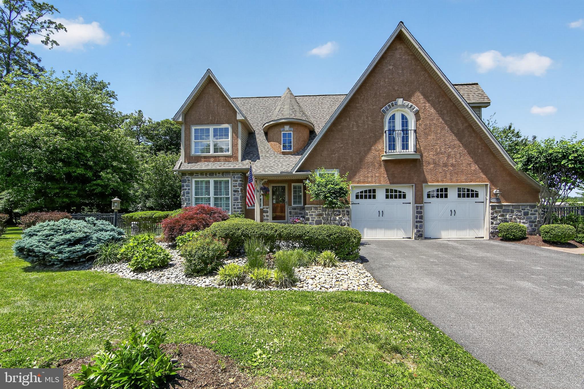 Original owners proudly present this impeccably maintained, thoughtfully upgraded single-family home in Kenmore Woods, an exclusive 10-home active adult community in sought-after Upper Providence Township (Media).
Serviced by an elevator with access to all three levels, this exceptional home offers an open-concept main floor with 9-foot ceilings, hardwood floors throughout, plantation shutters, a formal dining room, spacious family room with gas fireplace, large gourmet eat-in kitchen with beverage refrigerator and 2 ovens, all season sunroom, powder room, and a dedicated dog wash room. The oversized two-car garage features custom flooring and abundant storage. Sunlight pours through expansive windows overlooking lush gardens, a hardscape patio, wooded backdrop, and fully fenced rear yard with elegant fencing.
Ascend the sweeping staircase to the luxurious oversized primary suite featuring a tray ceiling, sitting area, and professionally designed walk-in closet. The expanded spa-like ensuite bath includes a 6 ft. soaking tub, tiled walk-in shower, and dual sink vanity. Two additional bedrooms each offer beautifully appointed ensuite baths and custom closet systems.  The front bedroom is currently outfitted as a stunning office with a beverage station and Juliet balcony. Hardwood flooring extends throughout the second-floor hallway and bedrooms. The laundry room is conveniently located on this floor.
The finished lower level offers an additional family room, fourth ensuite bedroom, multiple storage rooms, and direct access to the side yard.
Designed with both comfort and convenience in mind, the home features 35-inch-wide hallways and doorways, lever handles, rocker/dimmer switches, step-in showers with stability bars and a full home fire sprinkler system. There is even an attached tool shed for off season cushions and tools. Significant updates completed between 2022–2025 include a new roof, new driveway, flagstone front patio, full attic fan, two heat pump HVAC systems, a mini split for the Sunroom and a 24KW Generac whole-house generator that also services the elevator.
10 Kenmore Lane offers convenient access to Main Line Health at Ellis Preserve, Riddle Hospital, and Bryn Mawr Hospital. Outdoor recreation and everyday conveniences are just minutes away, including Springton Reservoir, Rose Tree Park, Ridley Creek State Park, and Whole Foods Market.
Enjoy a low-maintenance lifestyle with snow removal,road and common area maintenance all handled for you. Move right in and begin enjoying everything this exceptional home and community have to offer.