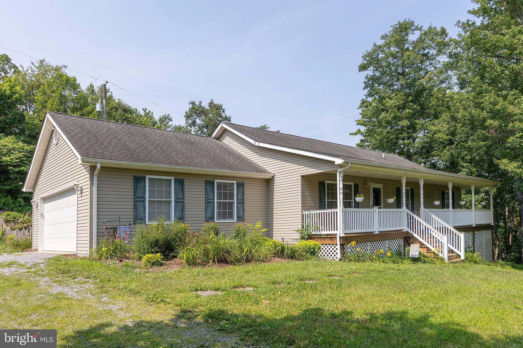 While heading out to wild and wonderful West Virginia make sure you stop by this Virginia rural retreat with little over 6 acres of woods, lawn, and a quick path to Rt.50 to head right into our great town of Winchester.  The ranch home is only 21 years young which the spacious and delightful open floor plan has the simple pleasures of roaming around without all the formal room blockades. Mix of hardwood and carpet and make sure you take in the front porch overlooking the neighbors pond and knowing you only have 3 neighbors.  The basement is a blank canvas with walkout access for storage needs or could be multiple future uses.  Unrestricted land use and there is a bonus of income from a billboard company.