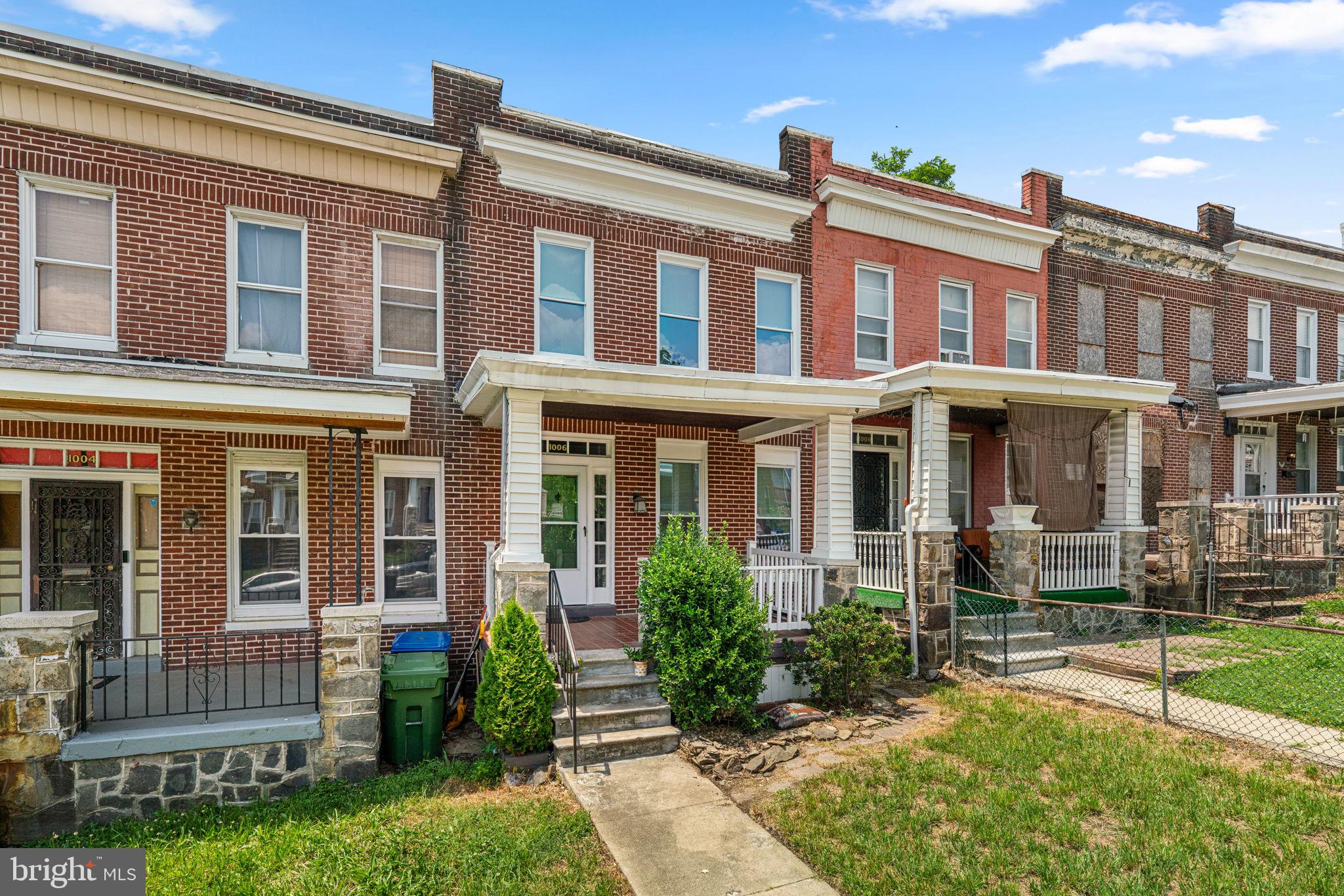 This gorgeous renovation holds to the traditional and classic feel of a city row house.  Original refinished hardwood floors with inlay and classic moldings to name a few, but with the modern amenities that makes it like a new home.  The living room has a gas fireplace, there is a dining room that opens to a breakfast bar and brand new kitchen with ample storage and counterspace, off the kitchen is a pantry area and a laundry room.  The primary suite has a custom paneled wall feature with a generous amount of living space.  Two additional bedrooms have ceiling fans and the bathroom is completely renovated.  The lower level features a family room, a stunning bathroom with walk-in shower, storage room plus a level walk-out to the backyard and patio.  There is a covered front porch and a covered rear deck too. This home shows how quality and style coexist within a great price point.