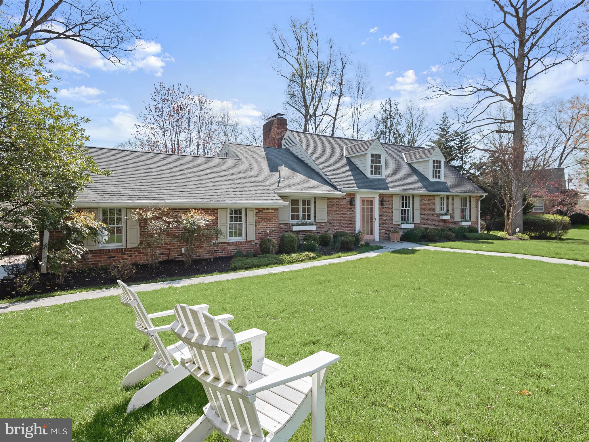 PLEASE NOTE: The tax record doesn't reflect the accurate square footage due to the addition. Welcome to 9305 Burning Tree Road, a picture-perfect Williamsburg Cape Cod on one of the most highly coveted streets in Bethesda! Thoughtfully expanded and updated, this home offers a seamless blend of modern living and traditional charm, featuring nearly 4,000 finished square feet, sited on a half-acre lot. With tremendous curb appeal, three spacious bedrooms, three-and-a-half bathrooms, multiple fireplaces, and a variety of impeccably designed open living spaces, you don’t want to miss this rare opportunity in the popular Whitman/Pyle/Burning Tree school cluster!

Step inside the elegant foyer and enjoy beautiful, lush views straight through the picture windows of the formal living room. With a wood-burning fireplace, built-in bookshelves, and a charming window seat flanked by two sets of French doors accessing the back patio, this sophisticated room is sure to wow your guests! Make your way to the updated eat-in kitchen featuring a cozy fireplace, large island, soapstone counters, ample white cabinetry, and tons of natural light. The adjacent sun-drenched family room with soaring two-story cathedral ceilings, gas fireplace, and tons of oversized windows allows you to enjoy cozy evenings at home or entertain a crowd. Step outside onto the picturesque flagstone patio for seamless indoor/outdoor living and entertaining. A formal dining room with tall ceilings and designer fixtures is the perfect additional space for holidays and more. The right wing of the home provides a renovated powder room, convenient main-level laundry, and a mudroom with a built-in bench, the perfect spot to enter from the oversized driveway.

One of the most unique aspects of this home is the accessible main floor primary suite, complete with multiple closets, a bonus room great for a sitting room or home office, tons of natural light, and a luxuriously renovated bathroom with a dual vanity. Upstairs, you’ll find two sunny, large bedrooms, with picture windows and charming window seats. Both bedrooms offer spacious walk-in closets, one cedar-lined, and an updated hall bathroom with a tub/shower combination completes the upper level. 

The walkout basement offers ample additional space for both comfortable living and entertaining. A large recreation room featuring the third wood-burning fireplace has ample space for a sitting area as well as a game table. Two additional bonus rooms with LVP flooring make the perfect spot for guests, a craft room, home gym, and more! Completing the lower level is a large renovated full bathroom and an expansive storage room with a workbench, built-ins, and a utility sink. 

Throughout the home, you’ll find convenient and luxury touches such as hardwood floors, recessed lighting, built-in speakers, custom window coverings, and more. Outside is a gardener’s oasis, boasting a huge flagstone porch and a large flat yard with beautiful landscaping and a variety of spaces for play or al fresco dining. A special bonus is the adorable shed for all of your gardening storage needs! Tucked away on a quiet cul-de-sac yet just minutes from I-495, downtown Bethesda, Wildwood Shopping Center, and so much more, this is the gem you’ve been waiting for!