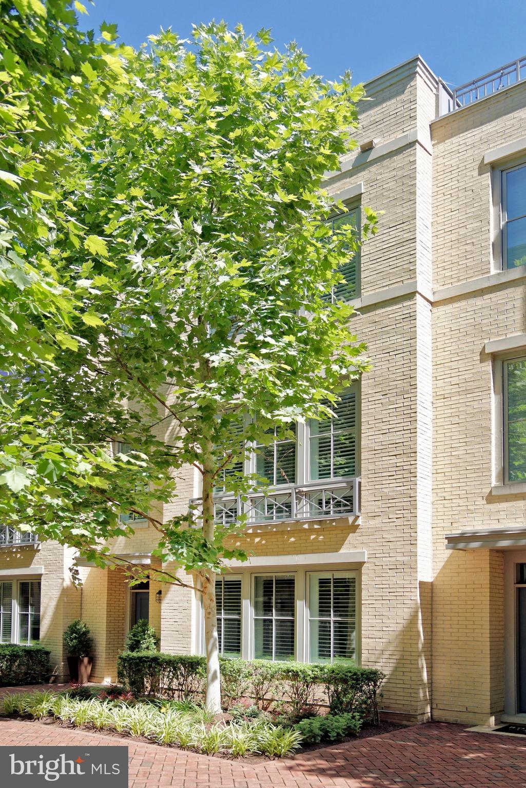 Sophisticated elevator townhouse in sought-after Robinson Landing features 4 bedrooms, 4.5 baths, and exceptional modern design.  This luxury residence offers high ceilings, gas fireplace, hardwood floors throughout, and a spacious rooftop deck.  Experience the open-concept living with a seamless flow between the living, dining, and kitchen areas, perfect for entertaining. The sleek chef’s kitchen boasts gas cooking, tile backsplash, quartz countertops, a long waterfall edge island, and access to a balcony, ideal for dining or relaxing.  The luxurious primary suite offers two walk-in closets and a spa-like bath. Two additional spacious bedrooms feature ensuite baths. A top-floor family room with wet bar adjoins the rooftop deck. The first-floor office or guest room also includes an ensuite full bath. A 2-car garage provides convenient parking.