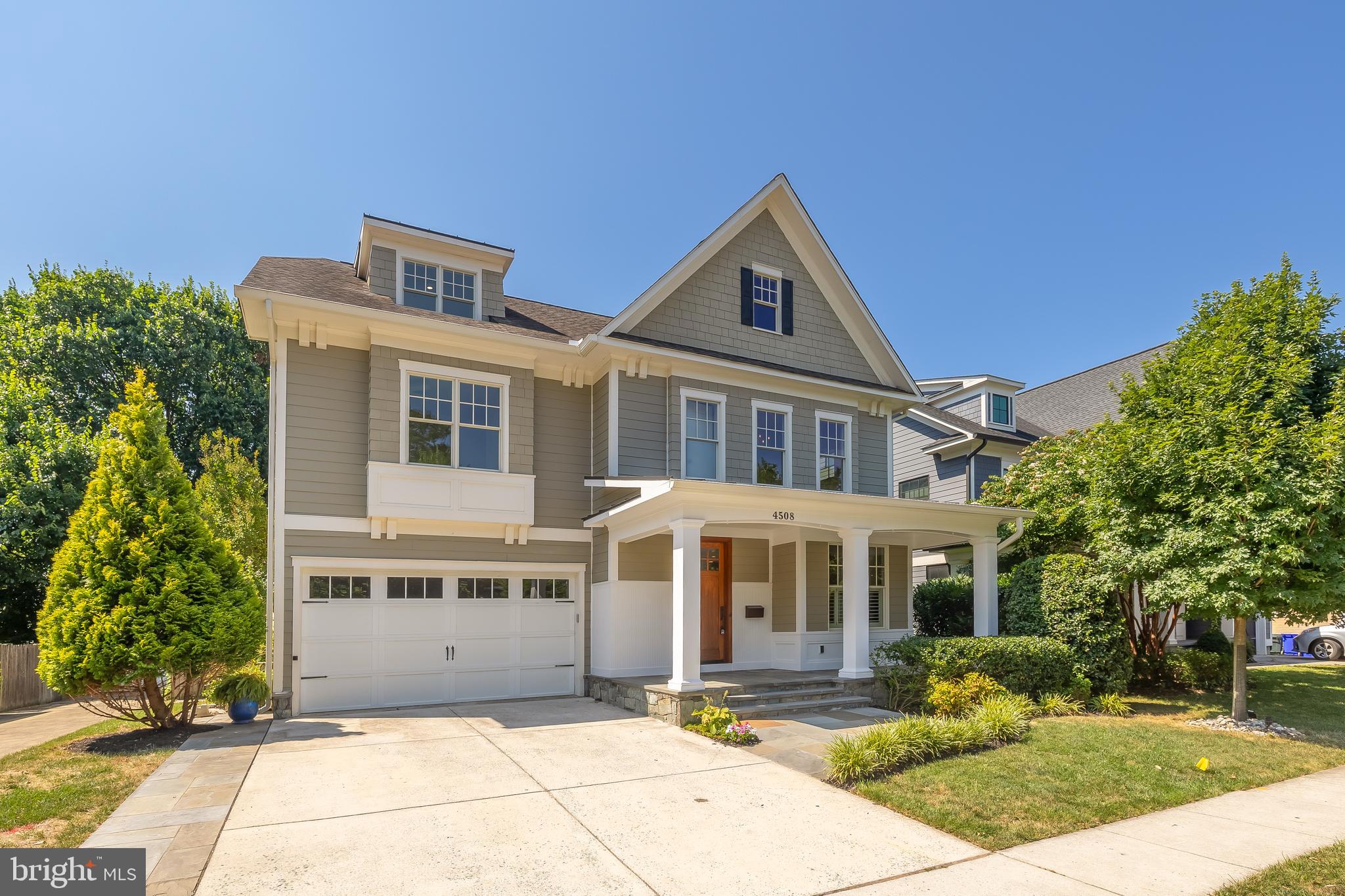 Welcome to your urban sanctuary! Nestled in the heart of highly sought-after East Bethesda, this home epitomizes modern elegance and functionality. Enter this Douglas Construction home to discover a thoughtfully laid-out main level boasting a seamless flow ideal for both daily living and entertaining. 
The foyer welcomes you with its polished hardwood floors and leads gracefully to the living and dining rooms, offering refined spaces for formal occasions with sophisticated molding details and gorgeous trim throughout. In the heart of the home, an updated kitchen with lustrous quartz countertops, stainless steel appliances, and ample cabinetry is open to both the breakfast nook and the lovely coffered family room, which is wrapped in windows, providing an abundance of natural light. A sleek bar in the dining room and a main level powder room enhance the home's entertainment capabilities. Rounding out this level is a spacious mudroom with direct access to the two-car garage, providing ample storage solutions. 
On the upper level, the primary suite exudes serenity with dual his and hers closets and a spa-like ensuite bath complete with steam shower and soaking tub, offering a calming retreat after a long day. This level also offers two generously sized bedrooms sharing a well-appointed Jack and Jill bathroom with separate sink rooms, while a fourth bedroom boasts its own ensuite bath. Convenience is key with a laundry room on this level with extra-large capacity machines. 
A versatile loft area on the third floor offers an open lounge or office space with an additional large bedroom and full bathroom. Descend to the expansive basement, where recreational opportunities abound with ample room for lounging and activities, space for a gym, plus a sixth bedroom and full bathroom. Outside, the airy backyard beckons with lush greenery, gorgeous hardscaped garden beds, and a spacious pergola, inviting you to savor dinners in an al fresco room decked with festive string lights and a ceiling fan for warm summer nights. This backyard oasis is one of the best in East Bethesda for both family and entertaining. The front porch, charming and inviting, sets the tone for warm welcomes and relaxed evenings. 
Enjoy the convenience of urban living paired with the friendliness of this beloved community. Easy access to downtown Bethesda, two Metro stops, commuter routes, and numerous parks, every amenity is within close reach. Enjoy the finest Montgomery County schools, dining, fitness facilities, and vibrant nightlife, all just minutes away from your doorstep.