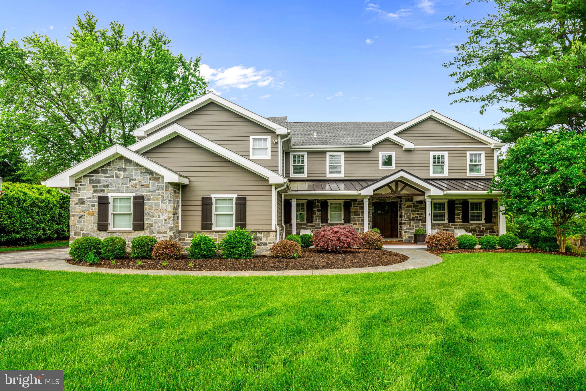 Welcome to 864 Monteith Drive, a one-of-a-kind, custom-renovated home offering over 8,000 square feet of luxurious indoor and outdoor living. Fully redesigned and expanded in 2018, this Main Line stunner is essentially newer construction, blending timeless style with modern design. From the moment you arrive, the home’s commanding presence is evident. A full exterior reconstruction introduced stone cladding, Hardi Plank siding, custom standing seam metal roofing, and elevated trim details in AZEK PVC. The covered front porch with Timbertech decking and classic composite storm shutters sets the tone for what lies within. Inside, enjoy 5,600 sq ft above grade, plus a finished 1,400 sq ft basement with a home gym, rec room, guest suite, radiant heat flooring, and golf simulator setup. The main floors feature site-finished White Oak hardwoods, all newer HVAC, plumbing, electric, windows, insulation, and custom finishes throughout.  There is a foyer with side sweeping staircase to second floor.  A first-floor office/study with glass door offering quiet efficiency. A standout feature of this chef-inspired kitchen is the expansive 16-foot marble island, which serves as both a generous workspace and a natural gathering spot. Other highlights include a Thermador Professional six-burner range with griddle, a Thermador dual-fuel oven for precision baking, as well as a Bosch electric oven, dishwasher, and microwave—all chosen for their reliability and performance. Cold storage is maximized with oversized Frigidaire Professional refrigerator and freezer units, delivering commercial-grade capacity in a residential setting. Overall, this kitchen is a masterclass in design and functionality—crafted for serious cooking, effortless entertaining, and everyday living.  All adjacent to an overflow seating area and large sliding doors overlooking the lush rear yard and landscape.  The formal dining room can seat 16+ guests for dinner. The great room offers recessed lighting, in wall speakers, plantation shutters and a rear staircase to upper floor game room with vaulted ceiling, pool table and living quarters.   The oversized 3+ car garage offers a workshop, loft storage, built-ins, and even a 220v generator hookup.
Love to Entertain? The resort-style backyard includes a saltwater pool and spa, plus a covered outdoor living room with TV, radiant ceiling heaters, and barn wood accents and another covered full outdoor kitchen with stone cabinetry, pizza oven, grills, fridge, sink, Dekton counters, bar seating and built-in lighting. All overlooking a stunning heated pool and spa with new plaster, Pentair wireless controls, and Polaris cleaner.  Front and back yards are professionally hardscaped with patio and stamped concrete walkways and lighting.
The upper level of this home is thoughtfully designed with two distinct living areas. The main section offers three spacious bedrooms, one with a private ensuite bathroom and the other served by a large hall bath and a convenient second-floor laundry room with granite countertops, sink and cabinetry.  At the heart of the second floor lies the luxurious primary suite, a true retreat featuring a cozy sitting area, walk-in closets, and a spa-inspired bathroom complete with a double vanity, oversized shower with a rain head, and a soaking tub.  This serene space flows seamlessly into a vaulted great room, perfect for relaxation or entertaining, with a pool table and large TV area. Nearby, a second hallway leads to two additional bedrooms that share a hall bathroom—ideal for family or guests.
Incredible lower level with gaming/movie watching area, potential 6th bedroom with full bath and walk out lower level, gym and golf simulator set up.
Located in the award-winning T/E School District (walk to New Eagle Elementary), minutes from downtown Wayne, shopping, dining, and regional rail. This is luxury, redefined.