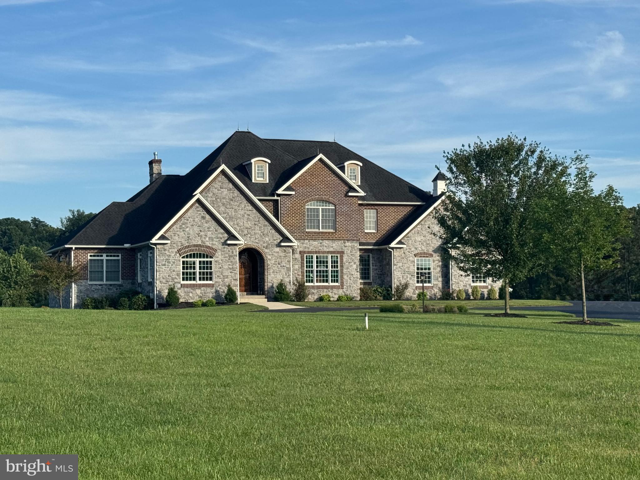 Welcome to this exceptional custom-built residence located on over 5 private acres in the highly sought-after Allen Glen neighborhood. Designed with timeless architecture and refined finishes throughout, this home features over 6,000 square feet of living space, including 4 bedrooms, 4.5  bathrooms, and a finished basement.