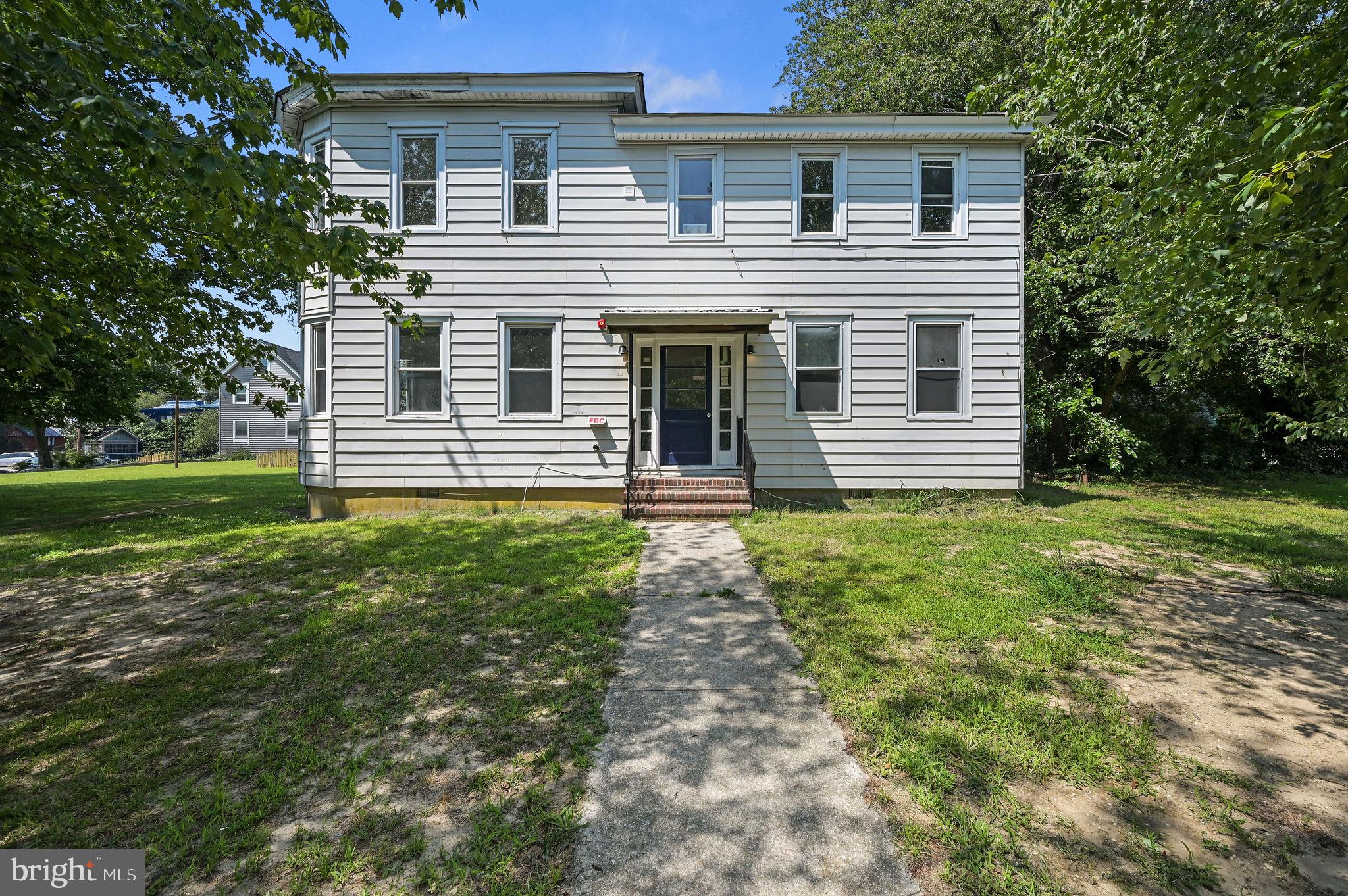 Premier Multifamily Investment Opportunity in the Heart of Milford. Positioned in one of Delaware’s fastest-growing markets, this exceptional four-unit multifamily property offers a rare opportunity to acquire a substantially renovated income-producing asset with significant upside potential.

The building features four thoughtfully designed residential units, including one spacious 3-bedroom, 1-bath residence and three well-appointed 2-bedroom, 1-bath residences. Extensive renovations have already been completed! Improvements include a brand-new roof, five new 200-amp electrical services, individually metered water and electric for each unit, separate high-efficiency HVAC systems, all-new plumbing throughout, and a professionally installed fire sprinkler system with a monitored alarm for enhanced safety and peace of mind. The heavy lifting has already been completed—simply install the appliances!

Ideally located just moments from Route 1, this property benefits from convenient access to shopping, dining, healthcare, schools, and Delaware’s beach destinations, making it highly attractive to future tenants and investors alike.

Beyond its immediate income potential, this offering presents a compelling opportunity for future growth. Subject to buyer due diligence and all required zoning, municipal approvals, the property may support the construction of an additional multifamily building on the existing parcel, providing the potential to significantly expand rental inventory and maximize long-term returns. Buyer to do due diligence regarding square footage of each unit. 

Whether you’re seeking a stabilized income-producing asset, a strategic addition to an investment portfolio, or a property with future development potential, this is a distinctive opportunity to invest in the continued growth and revitalization of Milford. Schedule your private tour today and discover the possibilities this exceptional property has to offer.