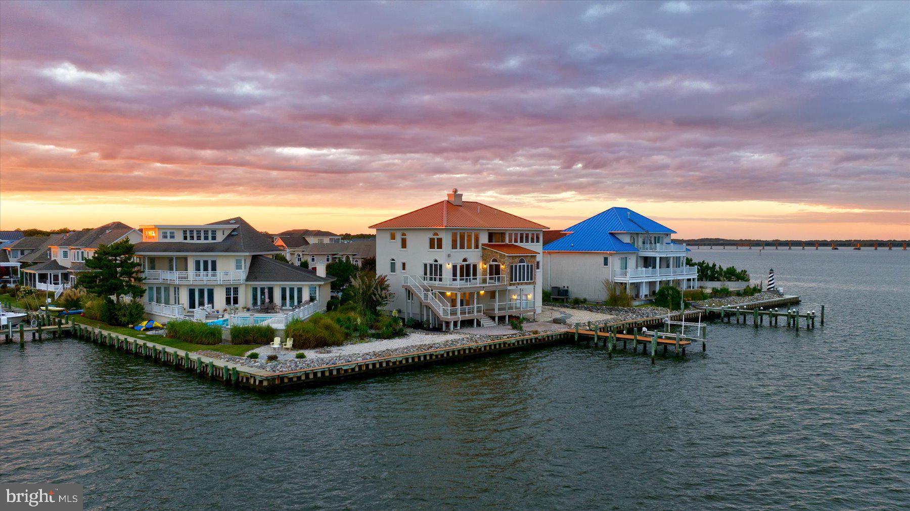 The opportunity to own the premier property in Ocean Pines comes around only once in a blue moon. Situated on a point lot on Leigh Drive with the most unobstructed views in the Tern’s Landing neighborhood. The 3 level Mediterranean masterpiece has been tastefully curated blending elevated style, design, and architecture. Privately nestled at the end of a cul-de-sac, this 4-bedroom home promotes an indoor-outdoor lifestyle with balconies and decks on every level to admire the panoramic views of Ocean City. Posh customizations including Walker Zanger tiles, Emtek doorknobs, Ralph Lauren pure wool carpet, Kohler faucets, Subzero and Bosch appliances to name a few. Featuring an expansive primary suite with secluded balcony and telescope lookout. Maintenance free exterior with Techo-Bloc pavers and 200 feet of vinyl bulkhead with dock and boat lift. This home radiates coastal luxury and sophistication. Call today for more information!