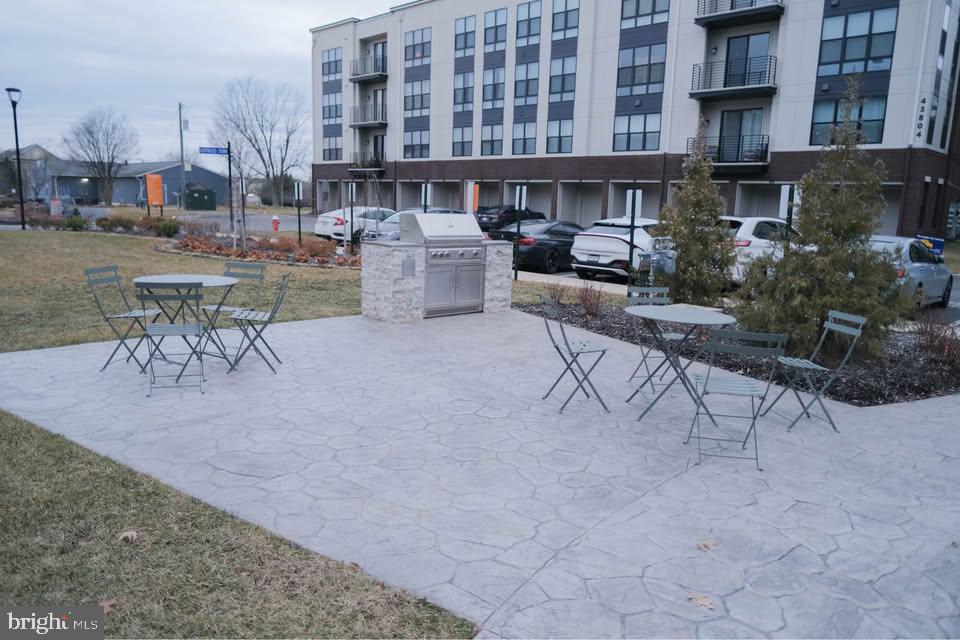 High  End Living in the center of Ashburn. 1Bed 1bath available for rent! This one level, open conce  is so beautiful with all the modern touches. Lovely main level  unit with gorgeous, natural colored LVP floors throughout. The modern kitchen with pantry closet will dazzle you with its quartz counters and huge kitchen island, single mount sink, five burner cooktop, hood vent, upgraded refrigerator, and modern white cabinets! Open concept to the kitchen is the spacious family room and adjoining dining room.  Enjoying relaxing here with the unobstructed open view in front. The Primaryb edroom is huge, and primary bath has upgraded modern floor/shower tiles, frameless shower, dual vanities, with large mirror. It also has a huge walk-in closet and second closet.  Additional perks include custom blinds and drapes, outlet for electric vehicle charging in the garage, and lots of natural light flooding into the condo. The courtyard in front has relaxing lounge chairs, fire pit, and bbq grills. Great location less than 1.5 miles to the Loudoun Metro, quick access to tons of stores and shops, One Loudoun, as well as the Dulles Greenway and Dulles Airport! Get it before it s gone!