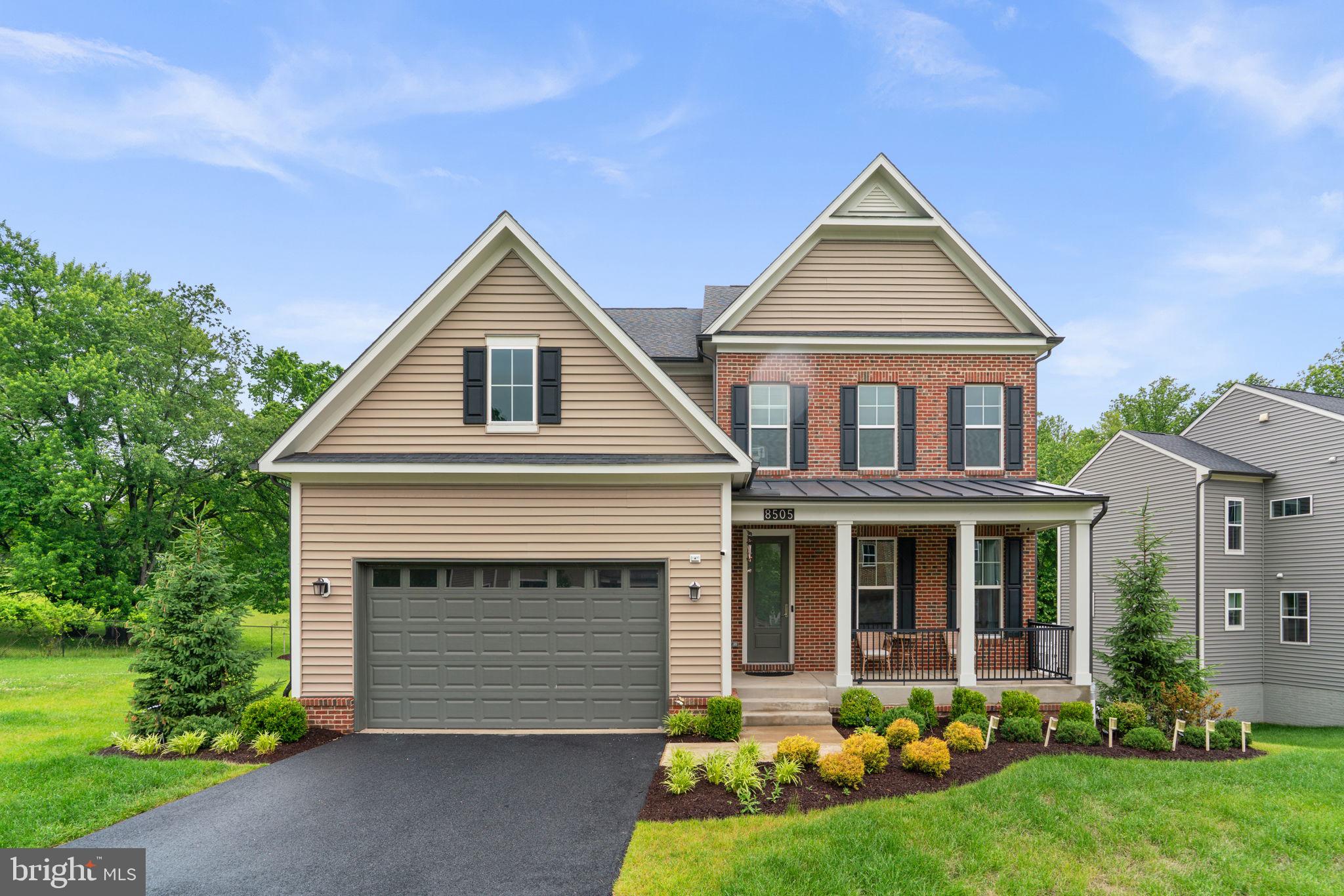 Stunning Colonial residence, newly built in 2022, offering 4,201 finished square feet in sought-after Patapsco Crossing. Thoughtfully designed with modern finishes and exceptional living spaces, this impressive home showcases LVT flooring throughout the main level, attractive landscaping, and a spacious covered front porch that creates a warm and welcoming first impression. The foyer opens into a formal dining room accented by a modern chandelier and continues into a convenient butler’s pantry for effortless entertaining. Additional technology and infrastructure enhancements include in-ceiling speakers on all floors for integrated whole-home audio and a whole-house water filtration system installed at the main supply line for clean water throughout the home. // The beautifully appointed eat-in kitchen features stainless steel appliances, a dramatic ceiling-height custom backsplash, vibrant blue island cabinetry with breakfast bar seating, crisp white perimeter cabinetry, abundant counter space, and a cozy breakfast nook with exterior access. Open to the kitchen, the expansive family room is anchored by a sleek modern fireplace, creating the perfect gathering space for everyday living and entertaining. A versatile main-level bedroom or private study with dual-access to a full bathroom adds flexibility, while a stylish mudroom with wood wall panel accents enhances both charm and functionality. // Upstairs, a spacious loft provides the ideal setting for a reading lounge or secondary sitting area, accompanied by a conveniently located laundry room, four generous bedrooms, and three full bathrooms. The upper level is enhanced by impressive 9-foot ceilings, adding to the home's spacious and airy feel. The luxurious primary suite is a true retreat, featuring barn doors leading into a spa-inspired ensuite bath with a striking partial glass wall, a doorless wet room complete with a built-in bench shower and Roman soaking tub, dual-sink vanity, separate water closet, and direct access to a walk-in closet. One secondary bedroom enjoys its own attached bath, while another full bathroom is centrally positioned in the hallway. // The walk-out lower level also features 9-foot ceilings and expands the home’s exceptional living space with an expansive recreation room featuring an alcove ideal for a media area, playroom, or home gym, along with a sixth bedroom with a walk-in closet and additional storage space. // Outdoor living shines with a covered and partially uncovered paver patio complete with swings, protected by an Under-Deck Drainage System that allows the covered patio area to be enjoyed even during rainy weather, while the elevated deck spans the full length of the home and includes stairs leading to the backyard garden area and peaceful open space backing to trees.