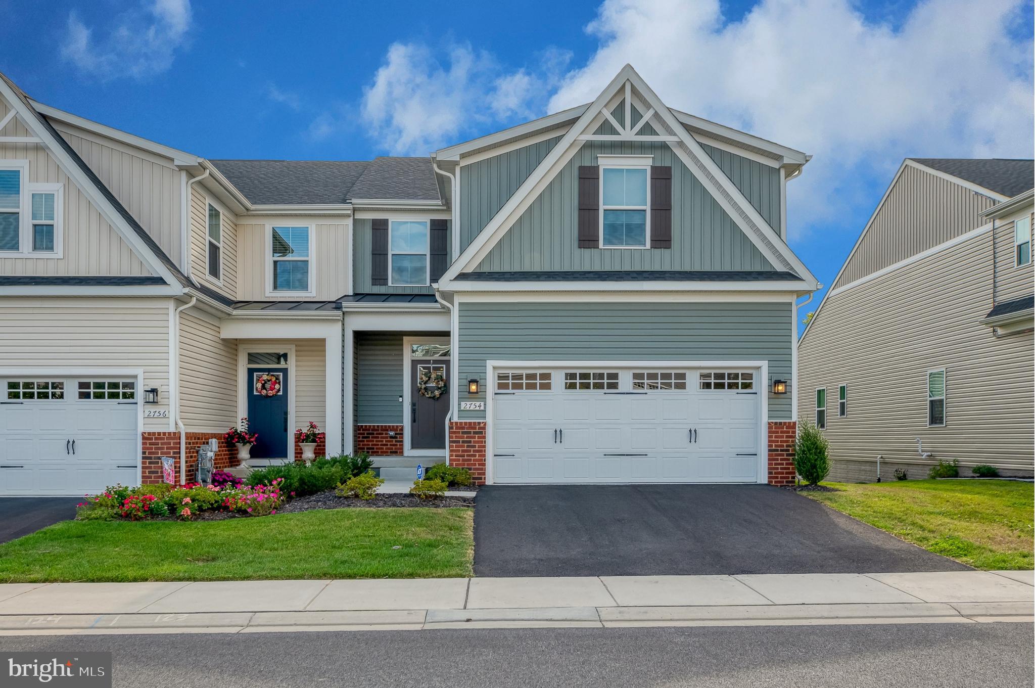 Welcome to this beautifully upgraded end-of-group Caroline Model carriage home offering over 3,700 square feet. With 3 bedrooms, 3 full baths, and 1 half bath, this home perfectly blends luxury, comfort, and functionality. Designed for convenient main-level living, the first floor features a spacious owner’s suite and laundry room, along with an open-concept layout ideal for everyday living and entertaining. The gourmet kitchen boasts upgraded cabinetry and countertops, tile backsplash, under-cabinet lighting, wall oven, and a large center island overlooking the dining area and living room. Upgraded luxury vinyl plank flooring enhances the entire main level. Upstairs, an oak staircase leads to two generously sized bedrooms, a full tile bathroom, and a dedicated office/study space, perfect for working from home or flexible living needs. The fully finished walkout lower level offers a large family room, a third full tile bathroom, LED lighting, wet bar plumbing rough-in, and a dedicated circuit for a second refrigerator, ideal for entertaining or guest accommodations. Situated on a premium lot backing to woods, the home offers added privacy and serene views from the 12x10 covered deck. Additional highlights include a tankless hot water heater, custom blinds throughout, and extensive post-settlement upgrades: a 36” double-sided fireplace between the living room and owner’s suite with floor-to-ceiling surround and mantle, an additional 42” fireplace with floor-to-ceiling surround, accent wall in the living room, shiplap in the powder room and garage entry wall, new kitchen pendant lighting, ceiling fans (lower level, owner’s suite, and porch), washer and dryer installation, and a finished garage with painted walls and floor coating. A rare opportunity to own a HIGHLY upgraded end-unit in one of Bel Air’s most sought-after communities. Schedule your tour today!