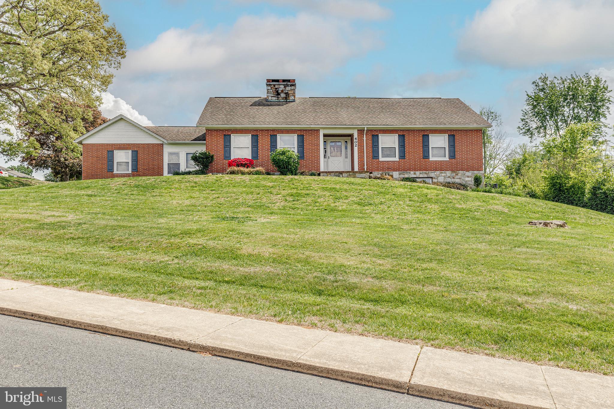 Welcome to this stunning, huge 4 bed, 2 full bath, very well cared for home in the town of Rising Sun; on a quiet & family oriented street.  This meticulously cared for home sits on a large corner lot, has a full walk out basement that features plumbing roughed in for another bathroom if desired. A large primary bedroom features it's own full bathroom with walk in shower. Original hardwood floors and interior doors keep original beauty. Fully updated to keep your family comfortable with Central Air/Heat that was installed approx 7 years ago. Washer, Dryer & kitchen appliances are also included in the sale and were purchased new 7 years ago. Enjoy year round entertaining & relaxation in the large sunroom; hosting outdoor gatherings on the back patio. With mature landscaping, there is plenty of room for outdoor activities to enjoy. Park in your attached garage and keep your gardening tools & mowers in the large shed. This property is a true gem of well built quality & design with ample space inside and out. Enjoy the ease of town living while still feeling private and peaceful.
 This home is being sold in As Is condition.