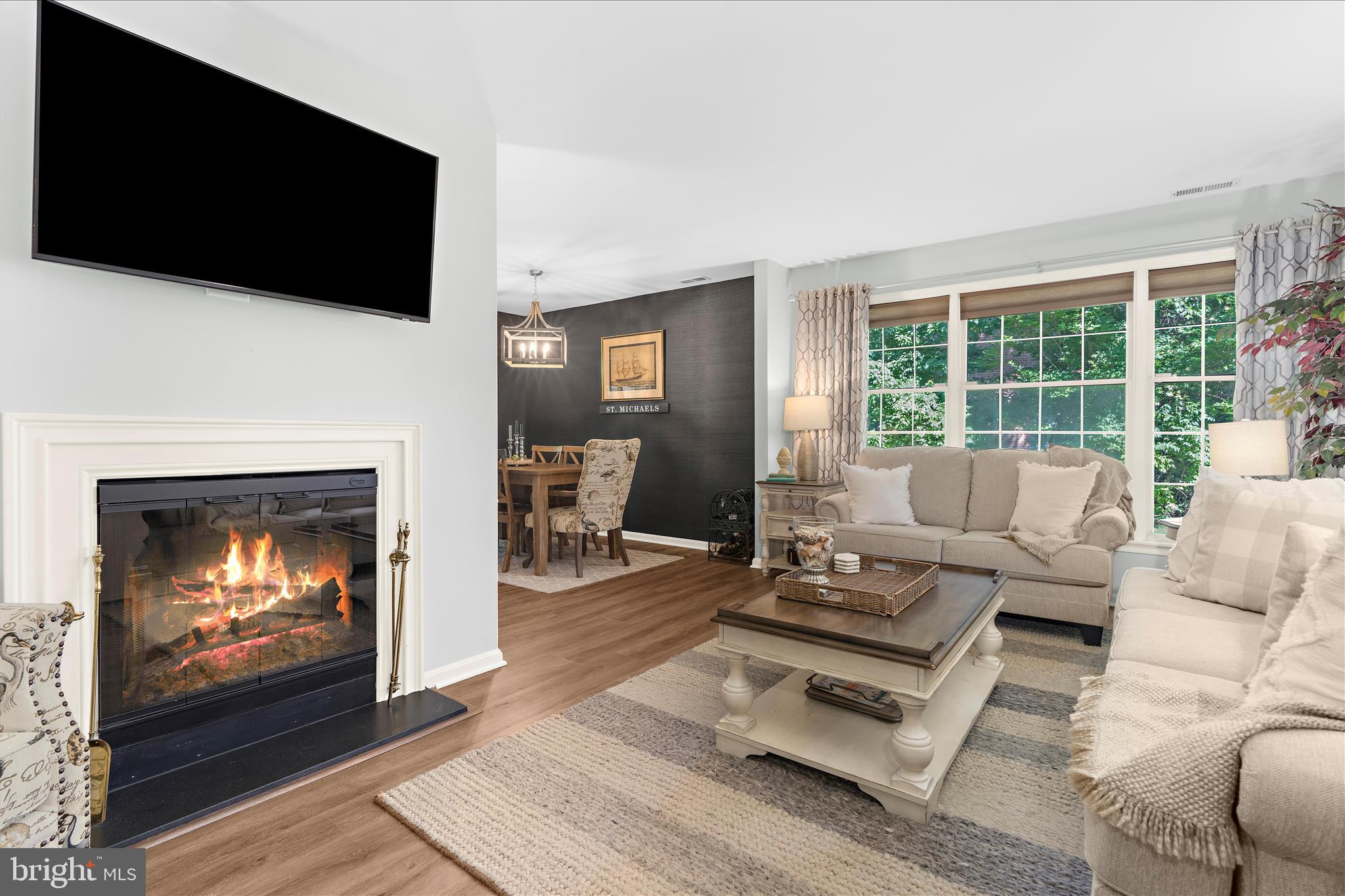 Want to live close to Historic Saint Michaels in a beautiful and low maintenance setting offering ample first floor living? Welcome to 24375 Widgeon Place, Unit 37, nestled in the picturesque Martingham Community just outside Historic St. Michaels . 

This desirable END UNIT property is the epitome of style and comfort, encapsulating all the charms of eastern shore coastal living.  Featuring 3 stunning bedrooms with 3 full bathrooms, offering generous living spaces and functionality, the property overlooks the beautiful Links of the Perry Cabin Golf Course, blending indoor comfort with  outdoor beauty. After you enter the vestibule/covered entryway, you're greeted by the foyer leading into the open living room area, which offers an inviting atmosphere, all new LVP flooring, a convenient wet bar, Bose sound system, and an electric fireplace, then unfolds into the dining area featuring  grasscloth wallpaper and is perfect for hosting social gatherings. Off the dining area is a well-appointed kitchen with hardwood floors and outfitted with Bosch stainless steel appliances, solid wood cabinets, ample storage, and a stackable washer and dryer area. The Anderson sliding glass doors are only a few years old and lead  to a private patio.  It only gets better with two spacious  primary bedroom suite options, one on the first floor boasting a  private sitting/office area, and the second  upstairs featuring its own private balcony with new trex decking, and wonderful views of the golf course. The 3rd bedroom on the second floor is large and spacious as well and storage will never be a problem with a walk-in attic off the large closet to accommodate your needs. 

NOTE: A portion of the garage was utilized to expand the first floor primary by prior owners, so the garage presently is suitable for storage and/or a golf cart. There is unassigned outdoor parking.  If you wish to convert the storage/golf cart sized garage back to a full one car garage, that is feasible without losing a main floor bedroom (ask listing agent for details). 

Additional upgrades: entire HVAC replaced approximately seven  years ago, a roof installed in 2011, two year old spout/gutter guards (gutters are cleaned by HOA),  and a lower deck/patio area built approximately eight years ago, and a long list of recent upgrades (past two yrs): Replaced the flooring throughout the condo (except kitchen)--so both levels--with a high quality LVP.  The stairs were redone in oak.  The kitchen floor is hardwood; Replaced (or added) new overhead light fixtures and ceiling fans throughout the unit, including adding under cabinet lighting in the kitchen and a utility closet light; Upgraded all electric outlets throughout the unit (they were original to the unit and the electrician advised it); Replaced the second floor balcony/deck with new roofing materials (underneath as it's essentially a flat roof so has all the components of roofing except for shingles) and new Trex decking materials;Put in  new downspouts off the rear of the unit; Every room was painted in muted coastal colors with the exception of the first floor bathroom which has a nautical stripe wallpaper; Upgraded window treatments (the cellular shades, curtain rods and curtains will convey if the buyers want them).

Whether it’s a weekend getaway situated on a golf course and near Historic St Michaels' renowned shops and restaurants  or a forever home you seek, this property is a tremendous blend of a vibrant community spirit and a tranquil, coastal life.