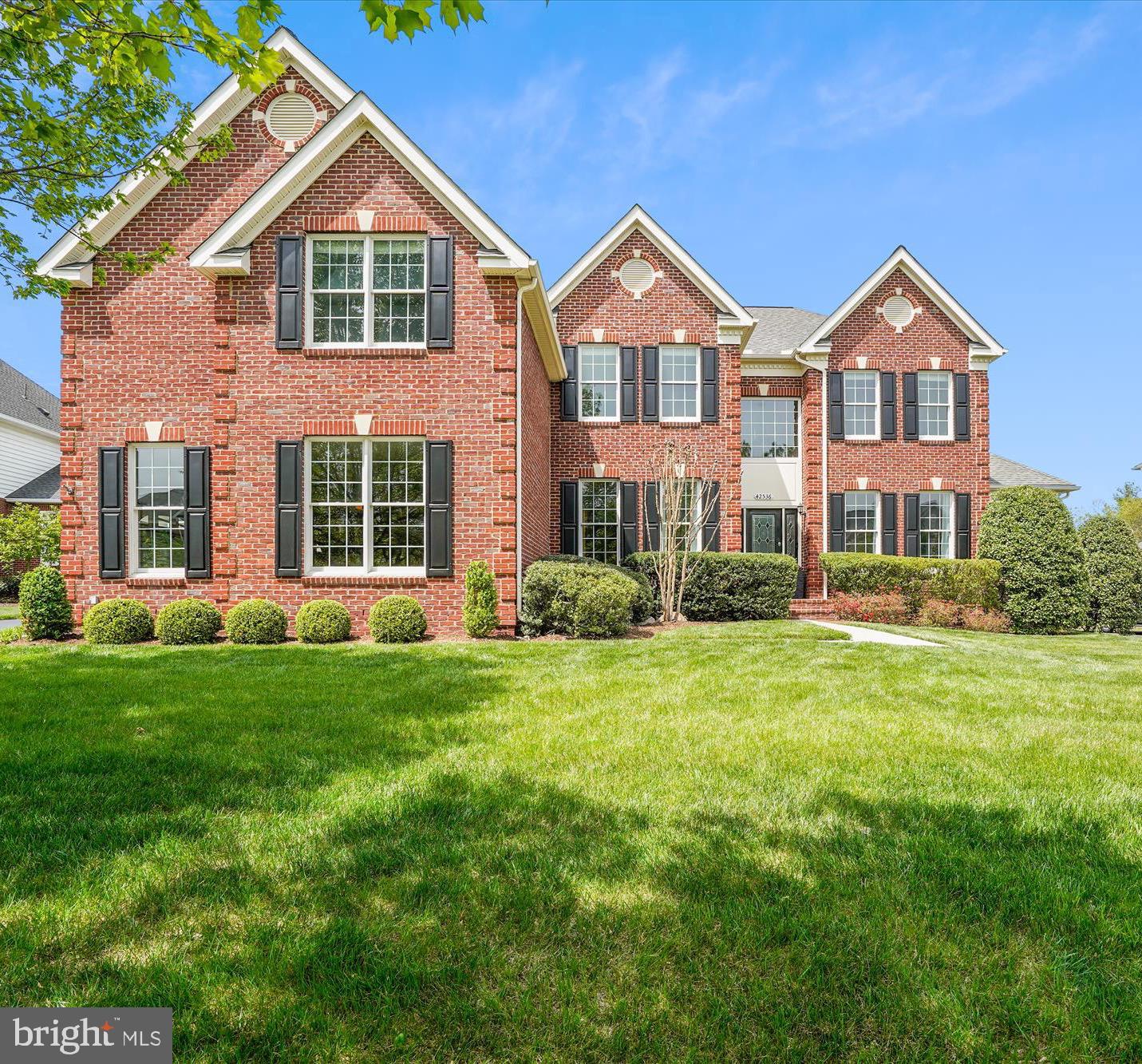 WELCOME to the Estates in South Riding. This Raleigh floor plan by Toll Brothers home has it ALL including your very own OASIS! Featuring 2 finished levels, coveted primary bedroom on the main level, 3 car side loader garage  and EXQUISITE  backyard with custom salt water pool. This estate is anchored by the two story GREAT ROOM w/ floor to ceiling stone fireplace and backdrop of windows that adorn it with a view to your own ENTERTAINER's DREAM and private backyard. Improvements: upper level carpet 2025, upper level HVAC unit 2023, kitchen refrigerator, washer and dryer 2020, HW floors and bonus room 2019, roof and gutters 2017, pool, fence, landscape and hardscape w/ grill 2012, stamped concrete patio 2008, irrigation system 2008 and much, much more... WELCOME HOME!