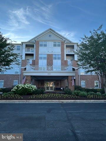 Experience refined main‑level living at 2604 Chapel Lake Dr #104, an elegant residence tucked within the prestigious Village at Waugh Chapel community. This beautifully appointed 1‑bedroom, 1.5‑bath /Den condominium offers nearly 1,000 sq ft of sophisticated comfort, blending timeless design with effortless convenience.

Upon entry, you’re welcomed into an expansive open‑concept living and dining space, where soft natural light and serene views create an atmosphere of quiet luxury.  French‑style atrium doors lead to a private balcony—your personal retreat for morning coffee or evening unwinding.  

The gourmet‑inspired kitchen features abundant cabinetry, generous counter space, and a charming breakfast area that elevates everyday dining. The primary suite is a sanctuary of its own, boasting dual closets—including a walk‑in—and a spa‑like en‑suite bath with an oversized shower.

A versatile den offers the perfect setting for a refined home office, reading lounge, or guest space. Thoughtful touches continue with an in‑unit laundry room enhanced with shelving for exceptional storage.

A rare luxury in condominium living, this home includes a full‑size 10' x 20' private garage with automatic opener—ideal for secure parking or additional storage for treasured belongings.

Residents enjoy exclusive access to a beautifully maintained building featuring an elevator, fitness center, community lounge with catering kitchen, and individual storage lockers. Outside, the community’s tranquil lake and walking path offer a picturesque backdrop for daily strolls.

All of this is set within steps of the vibrant Waugh Chapel Village, where upscale shopping, dining, entertainment, and everyday conveniences—including Wegmans and boutique retailers—are at your fingertips.

This is elevated, low‑maintenance living at its finest—perfect for those who value comfort, style, and an exceptional location.