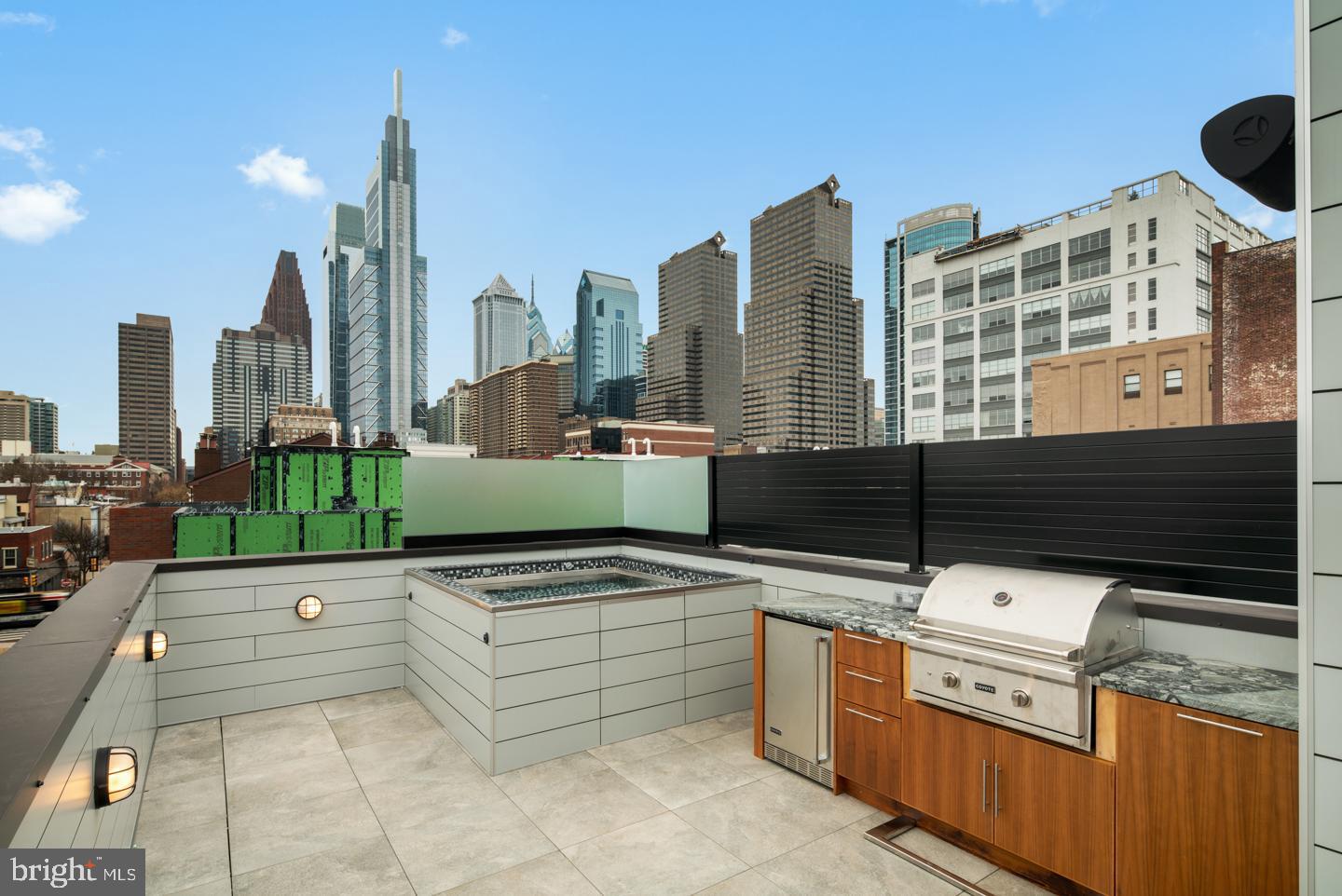 Fully Loaded home in the coveted Logan 23 development located in the Albert M. Greenfield School catchment in the 19103 zip code. 127 N. 23rd St, comes with a rooftop plunge pool and rooftop kitchen, a fireplace in the living room and several other upgrades. Logan 23 homes are Sensational new 4-story homes with 3-CAR GARAGES, GATED driveway, Tax abatement, 5-stop elevators, Smart-home systems (control 4), Roof-deck, three outdoor areas per home, and skyline views. FULL 10 year Tax Abatement approved!! Remember, at the end of 2020 the FULL tax abatement goes away!! This may be the last opportunity to purchase a home in 19103 with a FULL 10 year abatement. do not procrastinate!! Logan 23 has the exact amenities everyone has been looking for. 8 homes located on quaint Croskey Street and 8 homes on 23rd Street starting at the corner of Cherry Street. This amazing development has a gated driveway and luxury finishes throughout. The kitchen comes with luxury panel ready appliances, Quartz counters with 2 cm eased edges and a ton of high-end cabinets. There is a large deck off the living room, perfect for entertaining and the BBQ. All of the bathrooms have designer vanities, amazing large format tile selections, and custom fixtures with super cool mirrors and lighting choices. The full floor master suite is to die for and includes walk in closets with custom shelving systems, a five piece bathroom with free standing oval tub, huge walk in shower with glass doors, body sprays and his and her hand held shower fixtures. The elevator takes you all the way to the jaw dropping roof deck, which has stunning views. There are no other homes on the market like LOGAN 23. Fantastic location steps away from the new FITLER CLUB, Philly's only lifestyle club with world-class restaurants & bars, a Field House, study and event spaces. Also steps above Rittenhouse and a half block from the Schuylkill river trail!! More amazing features of the LOGAN 23 homes include, full size laundry rooms with W/D included, designer staircases with metal handrails, multi zone heating and air systems, alarm systems, fireplace and motorized shades options, Kohler plumbing fixtures, LED recessed lights, gated driveway, and again, 3-CAR GARAGES! Construction is 98% complete, as the photos reflect. The Croskey Street homes are identical to the 23rd street homes. There are only two corner homes available! All square footage numbers are approximate and include above and below grade square footage. Square footage should be verified by the buyer. It is the responsibility of the buyer to verify real estate taxes. Taxes and condo fees are estimated.