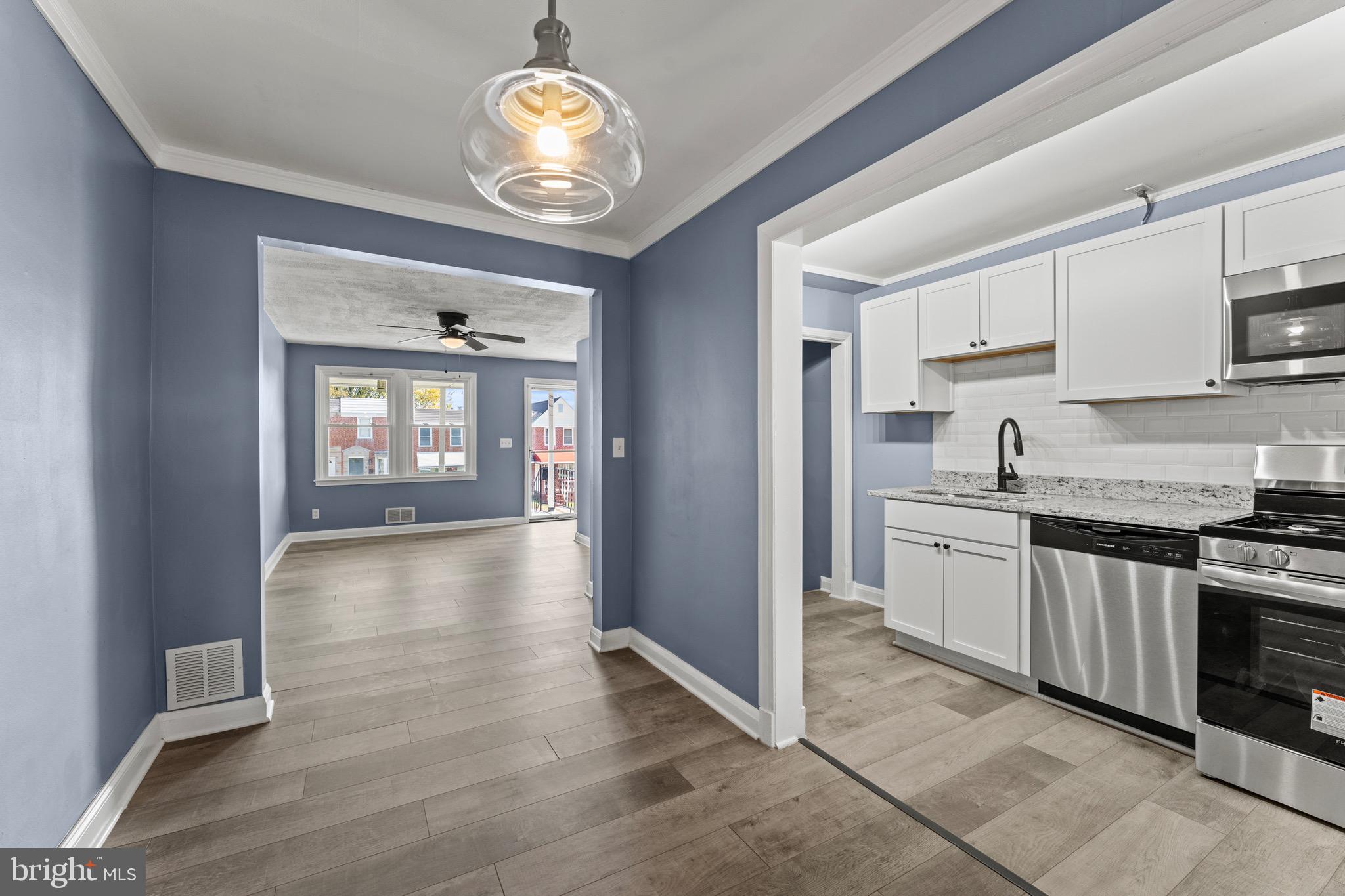 ***PRICE IMPROVEMENT***Welcome to 3693 Kenyon Avenue, a charming renovated row home nestled in the heart of Baltimore’s Belair-Edison community. This beautifully updated home blends classic Baltimore character with modern upgrades, offering the perfect balance of comfort and convenience. Step inside to find an open-concept main level featuring luxury vinyl plank flooring, fresh neutral paint, and abundant natural light throughout. The spacious living and dining area flows seamlessly into a modern kitchen boasting stainless-steel appliances, granite countertops, and sleek white cabinetry—perfect for everyday living or entertaining guests. Conveniently located near Herring Run Park, major commuter routes, Johns Hopkins, and downtown Baltimore, this home offers both accessibility and value. Whether you’re a first-time homebuyer looking for an affordable move-in-ready property or an investor seeking strong rental potential, 3693 Kenyon Avenue is ready to impress!