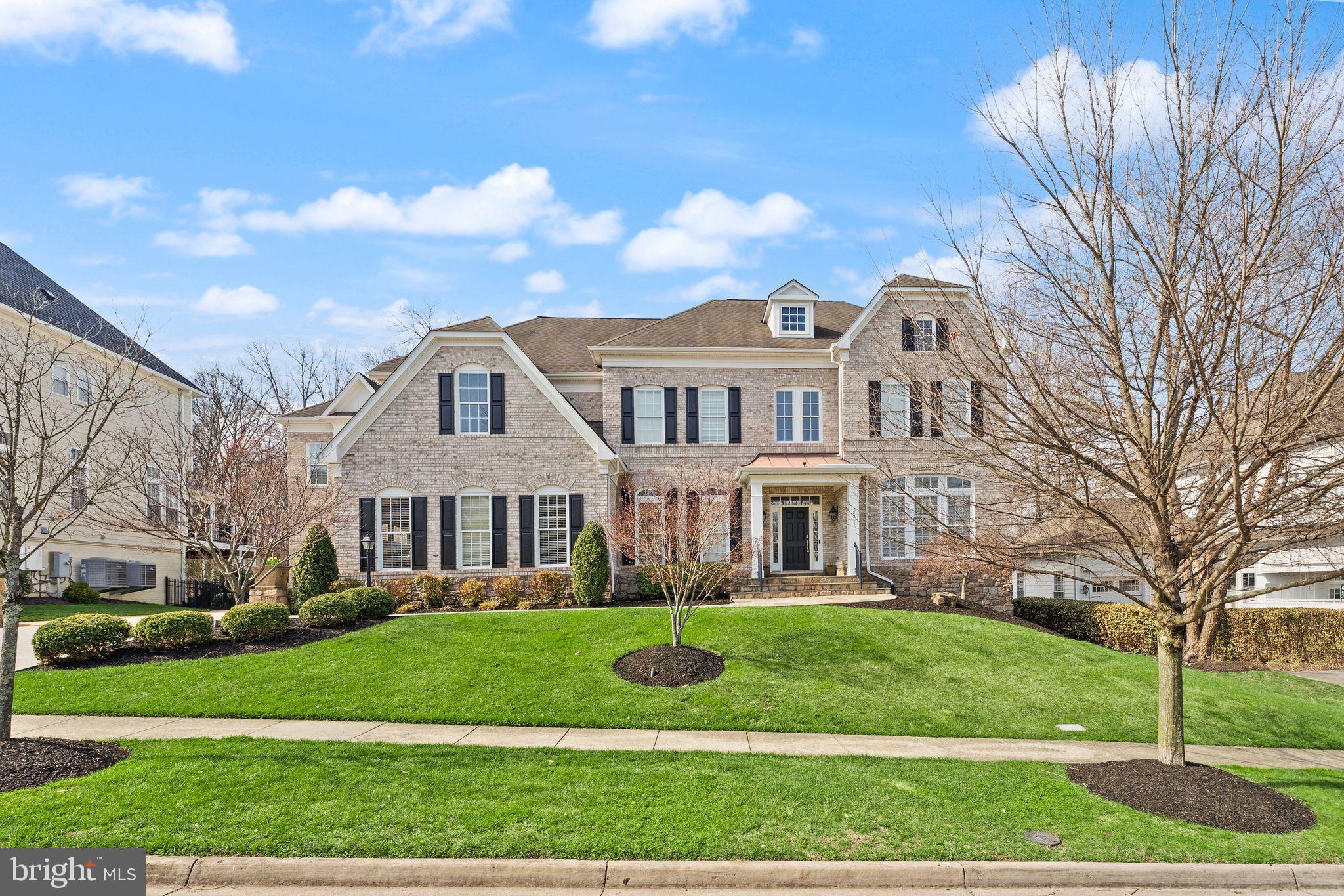 Open House Saturday April 18th 1pm -3pm**Expansive Lansdowne Estate with Pool and Privacy. This is the rare property that truly has it all! Set on a cul-de-sac street in Lansdowne on the Potomac, this 8,000+ square foot residence sits on a premium lot of over one-third acre with ideal access to neighborhood schools, all backing to mature trees for exceptional seclusion. More than $350,000 in recent updates reflect the finest craftsmanship throughout, with every detail thoughtfully maintained and upgraded. Tree-lined streets lead home to a picturesque property with a two-stall, three-car garage and manicured landscaping surrounding a stately brick facade. Inside, the covered entry opens to a dramatic double-height foyer with sweeping stairs and art-quality lighting above. New and refinished hardwood floors flow throughout the main and upper levels, while generously sized windows fill the formal living and dining rooms with natural light for both entertaining and everyday relaxation. The main level includes a private home office as well as a bedroom suite with full bath, providing a versatile option for multigenerational living. The heart of the home is an open concept chef’s kitchen, completely remodeled in 2023, which flows seamlessly into the family room, a sunroom breakfast area, and out to the screened porch for three seasons of outdoor enjoyment. The family room offers a fireplace beneath coffered ceilings and tranquil tree views. Upstairs, the primary suite is a retreat unto itself. A palatial bedroom features tall tray ceilings above a three-sided fireplace, a sitting area with deluxe coffee bar and fridge, and two walk-in closets with professional organizers. The primary bath includes a soaking tub, dual vanities, and a walk-through double shower for a true spa-like experience. Four more spacious bedrooms on this level each have direct access to one of three full baths, alongside a conveniently located laundry room, with separate stairs leading to a private in-law suite above the third-car garage. The finished lower level is built for living and entertaining, with an expansive recreation room featuring a fully equipped bar and kitchenette, fireplace, full-size daylight windows, and a walk-out to the backyard. A home theater room, gym and exercise studio, large legal bedroom with adjoining full bath, and powder room complete this level. Outside, the backyard is an oasis. A sparkling pool and secluded hot tub are surrounded by sun-kissed hardscape and a fire pit gathering area, all fenced and embraced by mature landscaping backing to woods. A side yard with lawn and gated access from the front adds even more usable outdoor space. Additional updates include two new HVAC units (2022), updated lighting throughout (2022), a whole-house steam humidifier (2024), and a new water heater (2021). The coveted community of Lansdowne on the Potomac offers first-class amenities including indoor and outdoor pools, a fitness center, playgrounds, sport courts, a ballroom, and more. Enjoy easy access to Route 7, Lansdowne Town Center, the Golf Club at Lansdowne, Lansdowne Resort and Spa, One Loudoun, hiking trails, and Bazil Newman Riverfront Park. With every amenity at your doorstep, this is estate living at its finest.