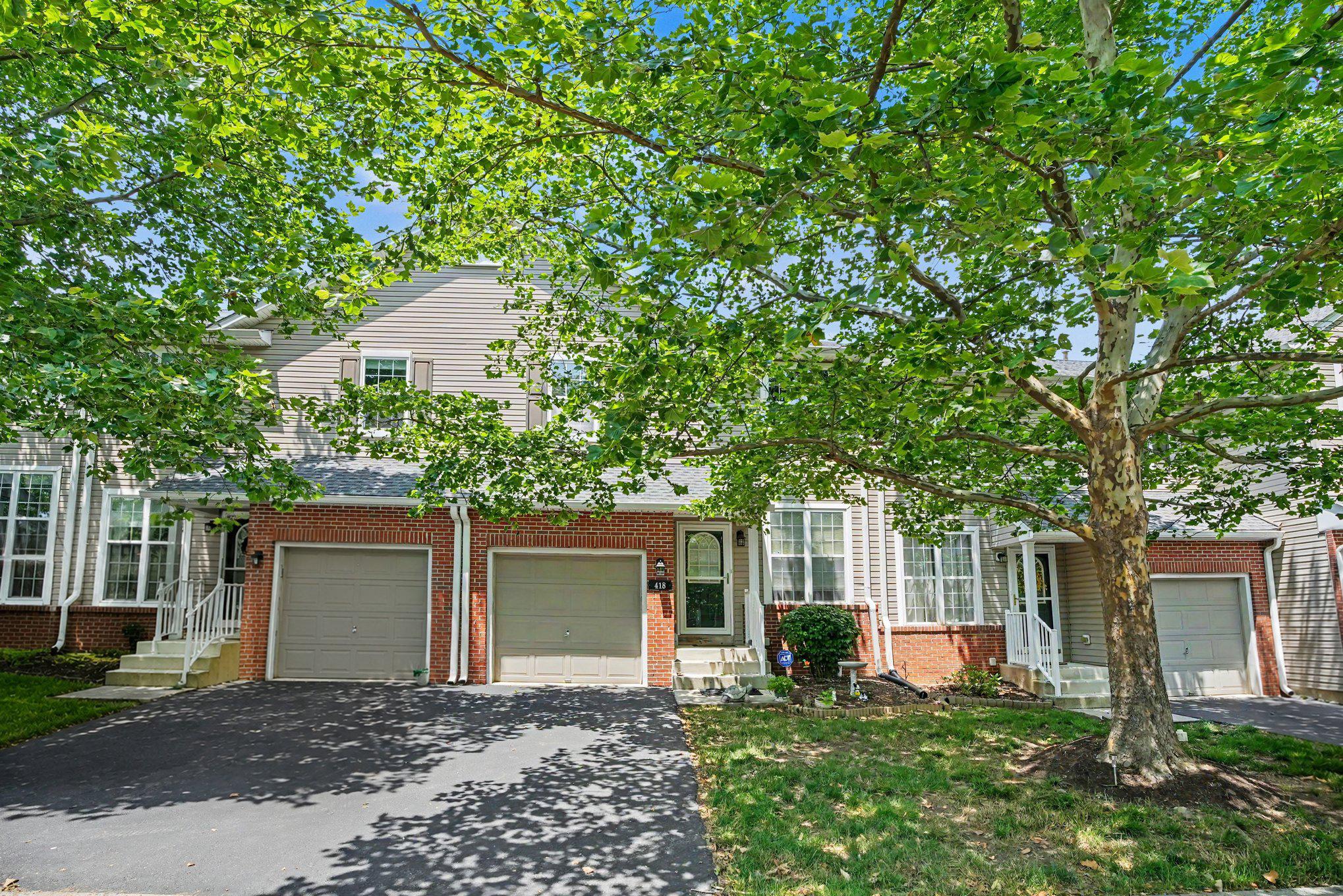 ***Showings begin June 30 ***Nestled in the charming Providence View community, this delightful Colonial townhouse offers a perfect blend of comfort and convenience. With over 2,000 square feet of thoughtfully designed living space, this home features three spacious bedrooms and two and a half bathrooms, ideal for both relaxation and entertainment. Step inside the front door to discover a warm and inviting interior, highlighted by a cozy fireplace. The fully carpeted living areas flow into a bright breakfast area and skylights offer the space natural light, enhancing the welcoming atmosphere. The well-appointed kitchen comes equipped with essential appliances, including a refrigerator, range hood/oven, dishwasher, and a kitchen island with room for stools as well as a quaint breakfast room area overlooking the backyard and with a slider to the deck. The upper level features 2 bedrooms, a clean and tidy hall bath and a Master suite that boasts a large bedroom area with vaulted ceiling, ensuite bathroom with stall shower and jetted tub and a walk in closet. Enjoy the huge finished basement (over 400 sq ft of finished space) with a walk-out to the backyard as well as a large utility room with ample storage and all your major systems for the home. Outside, you can enjoy a level lot surrounded by lush trees and woods, and the refreshed deck is a great space for hosting summer hangouts with friends and family. The 1-car garage has ample storage and a seller-added space in the rafters for additional storage! A few noteworthy updates include a new HVAC in 2021, brand new hot water heater in June 2026, a refurbished/repainted deck in June 2026 and most rooms having been freshly painted in recent years (2nd level in 2023). The community amenities, including a clubhouse with pool (includes family and guests of Providence View), tennis courts, and playgrounds, offer endless opportunities for recreation and socializing. Located in a suburban setting, this home is conveniently close to essential services and recreational options, ensuring a balanced lifestyle. With an association that covers exterior building maintenance, lawn care, and snow removal, you can spend more time enjoying your home and less time on upkeep. Experience the comfort and community spirit that this Providence View townhouse has to offer...schedule a private tour today!