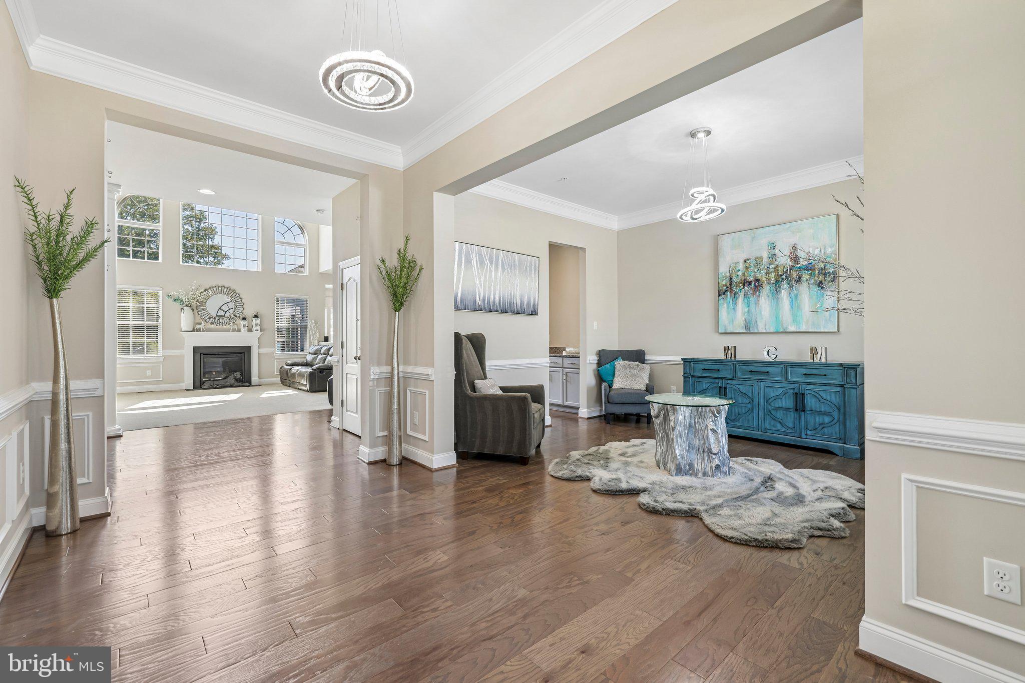 >> Absolutely Stunning <<This Immaculate, Well Cared For Home Resides in Sought After Greenliegh at Crossroads - Well Over 6,000 Square Feet of Living Space That Exudes Luxury - Open Floor Plan, Gorgeous Hardwood Floors, Soaring Great Room with Catwalk, In-Law Suite on Main Level, Gourmet Kitchen (Added Bonus Bump-out, Sun Room), Private Office , a Vast Primary Suite, Incredible En Suite, Large Bedrooms, Huge Finished Lower Level (Walk Out) and The Highlight is No Doubt The Incredible Private Theatre, Workout Room, Lots of Storage & There's Too Many Upgrades to List - The Community of Greenleigh at Crossroads is Baltimore's Hidden Treasure Offering a Fitness Center, Club House, Gorgeous Community Pool, Huge Tot Lot and Walkable Convenience to Shops & Restaurants - Easy Access Out to All Major Routes >> Welcome Home <<