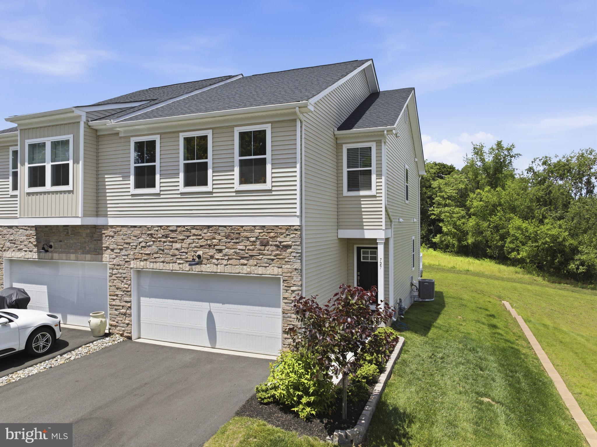Like-New 2024 Twin Home | Top Spring-Ford Schools | 
Discover effortless modern living at 727 Hunsberger Road - a beautifully crafted 2024 twin home tucked into Villages at Spring Hill, one of Spring City's most coveted communities. Boasting over 2,400 square feet of finished living space, including a sought-after fully-finished basement (a feature reserved for just a handful of premium homesites), this 3-bedroom, 2 full + 2 half bath residence offers the rare distinction of brand-new construction at exceptional value - well below today's new-build pricing.
A sun-soaked open-concept main level greets you with rich wood-looking plank flooring flowing through every room. The kitchen is a true showstopper — sleek stainless appliances, an oversized center island built for hosting, generous cabinetry, and clean modern lines that flow effortlessly into a welcoming family room anchored by a cozy fireplace. Slide open the doors to a private rear deck - your future spot for morning coffee, sunset wine, and unhurried weekend afternoons.
Upstairs, retreat to a generous primary suite featuring a walk-in closet and a serene en-suite bath with dual vanities. Two additional bedrooms with walk-in closets and a full hall bath complete the upper level. Below, the fully finished walkout basement adds nearly 500 square feet of versatile bonus space — endlessly flexible as a media room, home office, gym, playroom, or private guest suite.
★ EXCEPTIONAL VALUE: Lennar Builders 10-Year Structural Warranty active through 2034 - fully transferable to buyer, providing years of additional foundation and structural protection at no cost. Premium touches: 2-car attached garage, low-maintenance lifestyle with HOA covering lawn care, snow removal, and trash. Walk less than a mile to Spring City Elementary and the Spring City Community Pool. Minutes to shopping, dining, and major commuter routes connecting to Phoenixville, King of Prussia, and Philadelphia.
This is your rare chance to own a pristine 2024 home in one of Spring City's most desirable new communities — equally compelling as your dream primary residence or as a strategic investment opportunity. Schedule your private tour today — opportunities like this don't come along often!